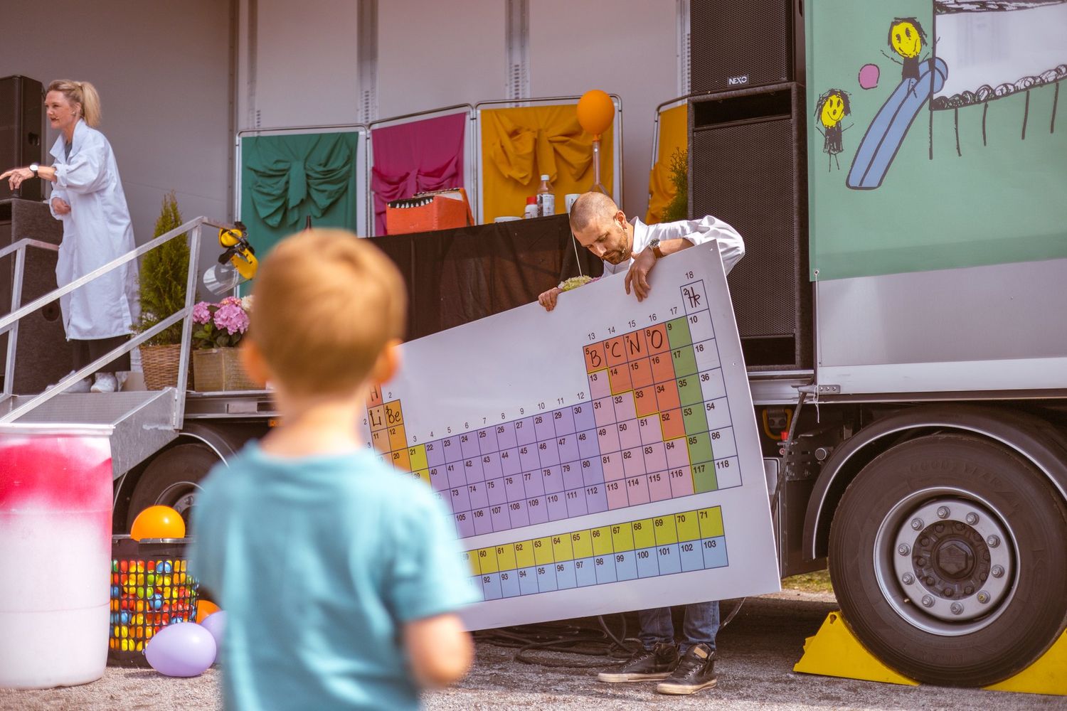 Colorful periodic table display being shown from a science education truck.