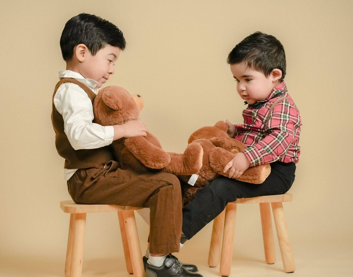 Sibling portrait with teddy bear in studio photography session in Boise Idaho