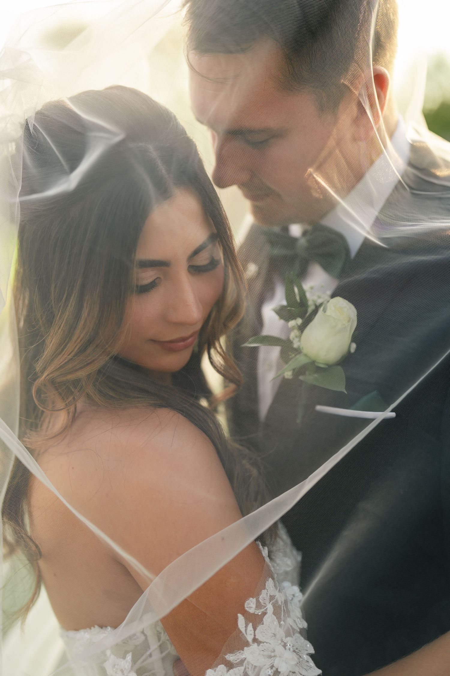 Romantic wedding couple shares intimate moments in a series of soft, dreamy close-up photos.