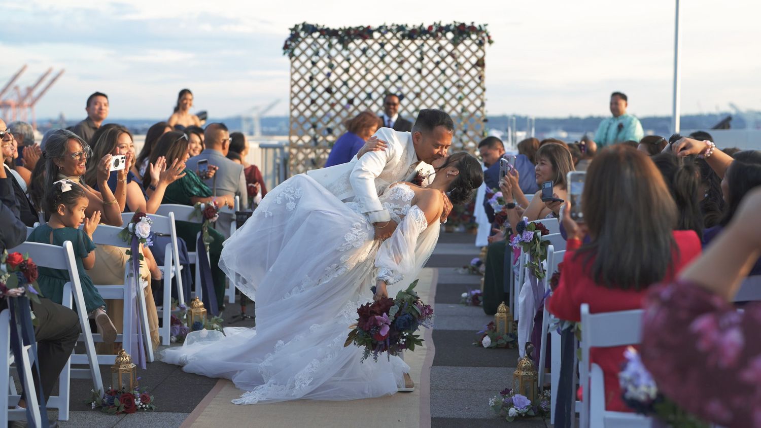 A collage of outdoor wedding reception photos showing tables, dancing, and celebrations by the water at sunset.