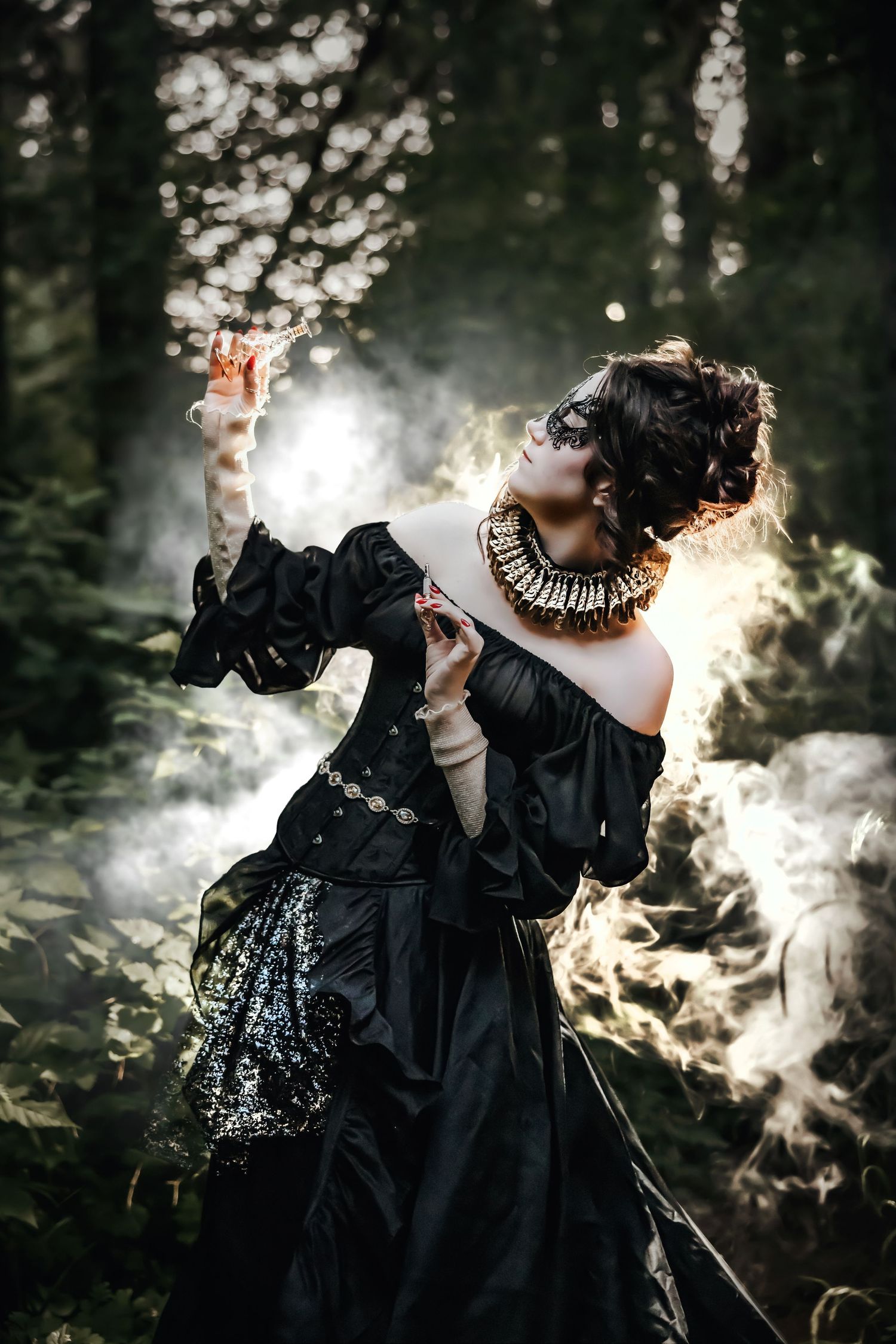 A person in a dramatic black Victorian-style dress poses in a misty forest with ethereal backlighting creating a magical atmosphere.