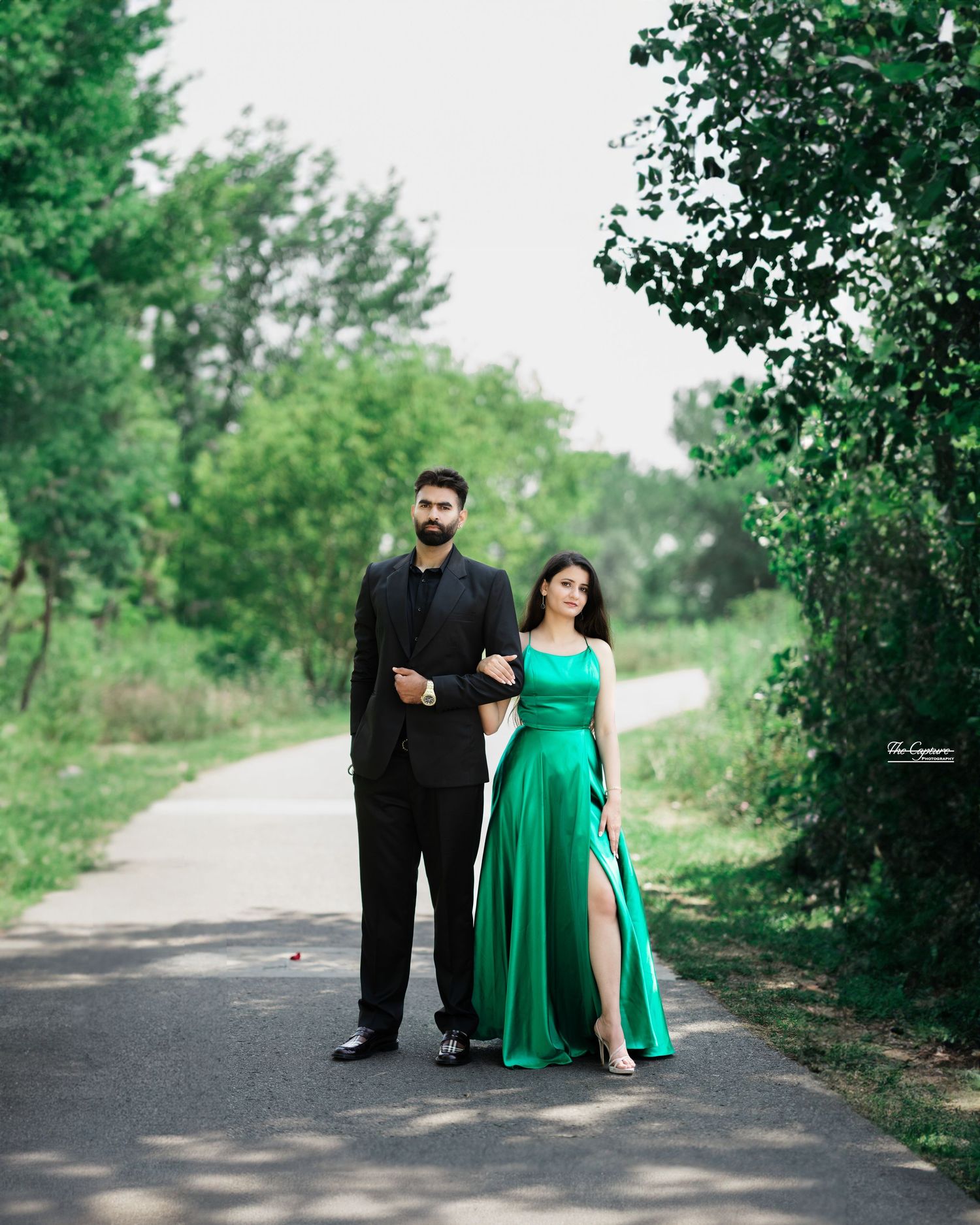 A fashionable couple exuding effortless style & confidence, captured in a striking pose that blends contemporary flair with classic romance