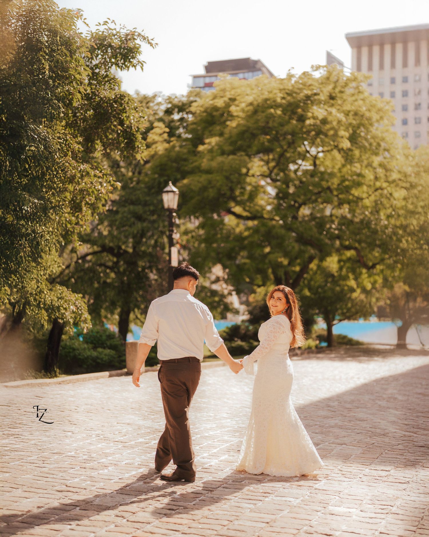 Casual outdoor walking photoshoot featuring Indian couple dressed in comfortable everyday attire, capturing natural smiles and candid moment