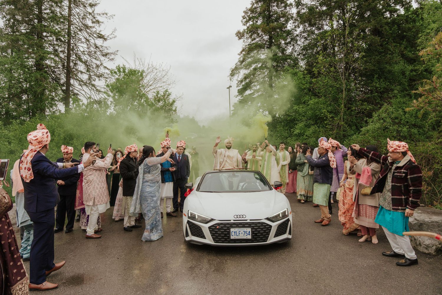 Lively groom celebrating with dance moves in baraat, capturing festive Indian wedding atmosphere in toronto