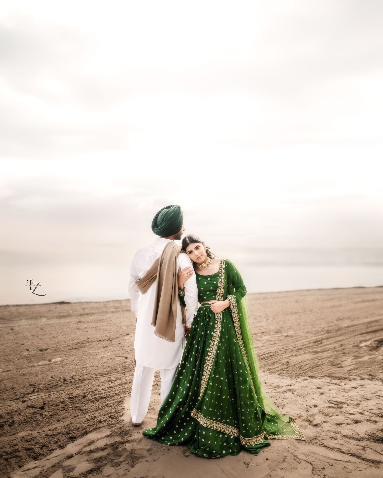 Punjabi couple striking a beautiful aesthetic pose in traditional outfits during outdoor photoshoot in toronto