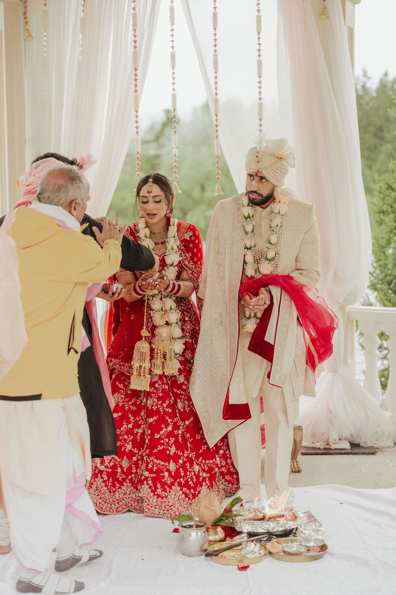 Candid photoshoot capturing intimate and sacred moments during traditional wedding ceremony with bride & groom in cultural attire in toronto