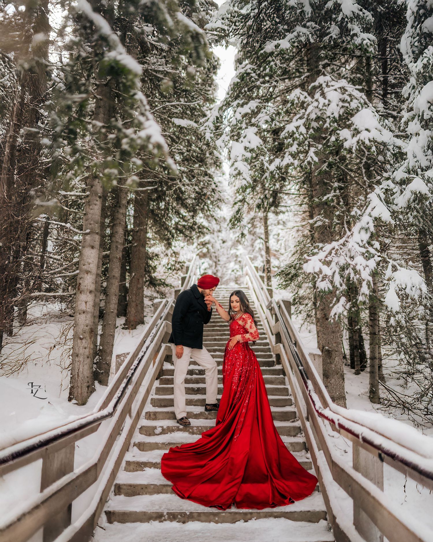 Elegant Indian couple engagement photoshoot in Banff with vibrant traditional clothing and dramatic mountain backdrops