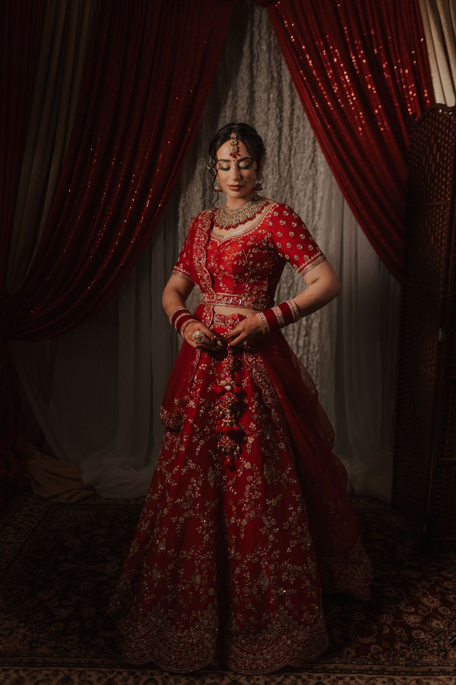 Candid shots of Hindu bride getting dressed and ready with family and friends before wedding rituals in toronto
