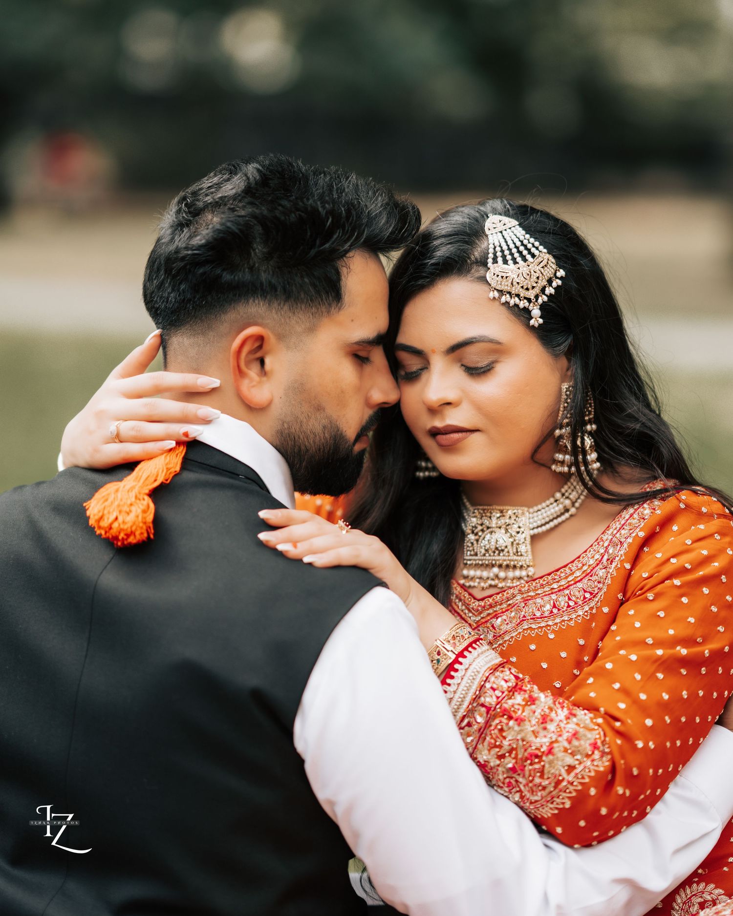 Elegant Indian engagement photography in Toronto capturing heartfelt moments and colorful traditional clothing in outdoor settings