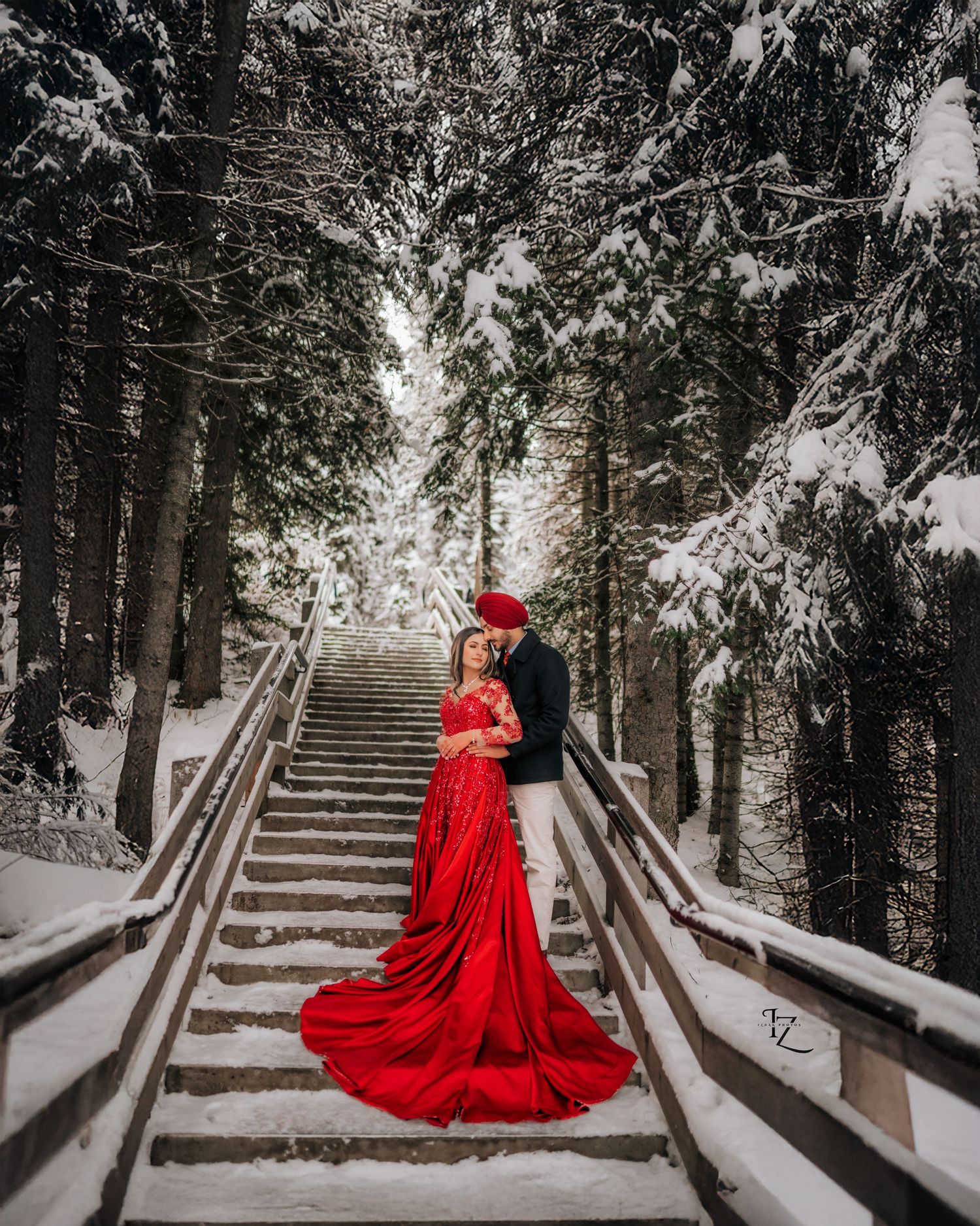 Elegant Indian couple engagement photoshoot in Banff with vibrant traditional clothing and dramatic mountain backdrops
