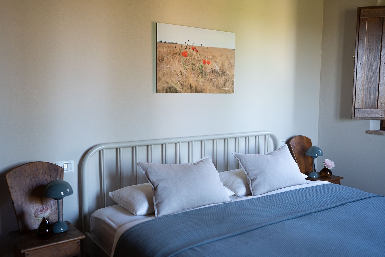 Modern bedroom interior with beige walls and simple furnishings in modern style.