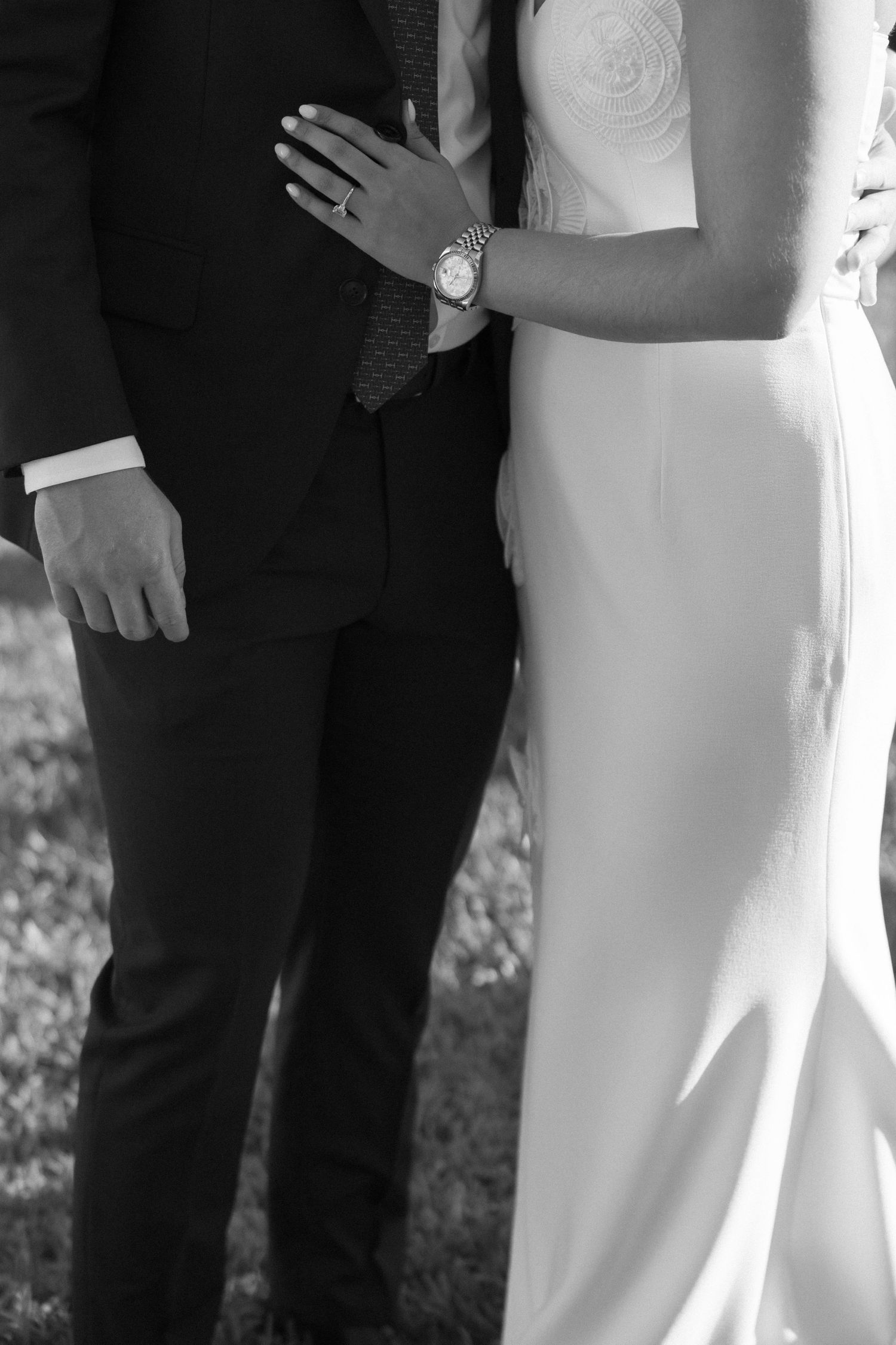Close-up shot of formal attire details in black and white.