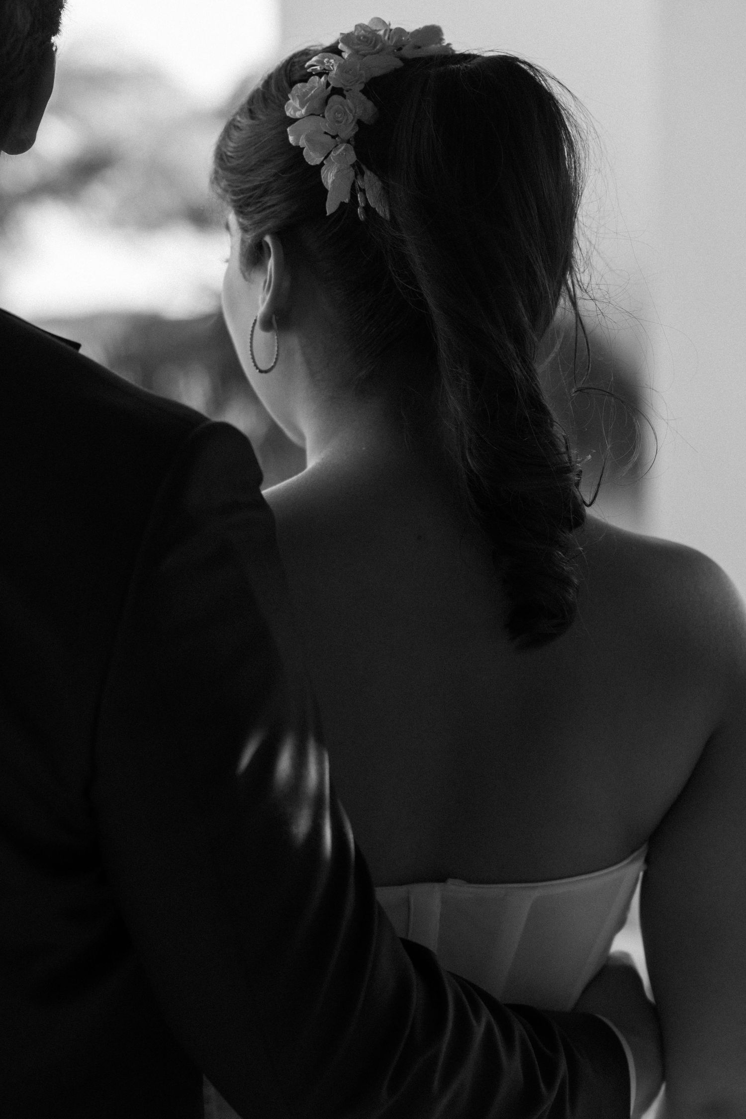 Black and white artistic portrait series showing silhouettes and dramatic lighting at a wedding.