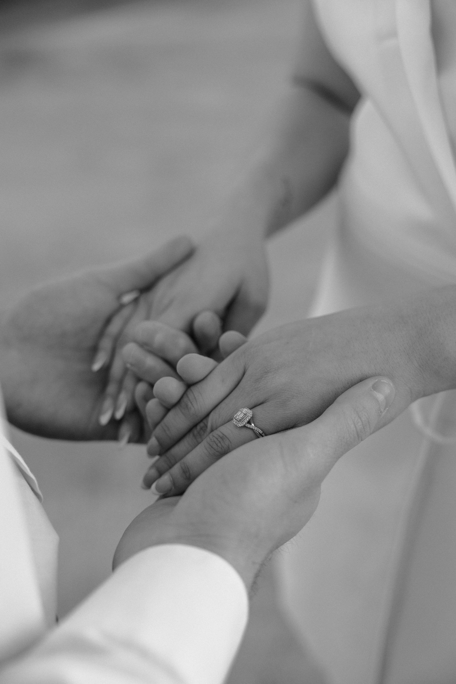 Series of intimate hand-holding moments in black and white.