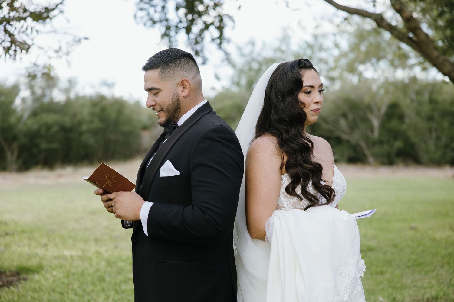 Wedding couple shares tender moments during outdoor photo session.