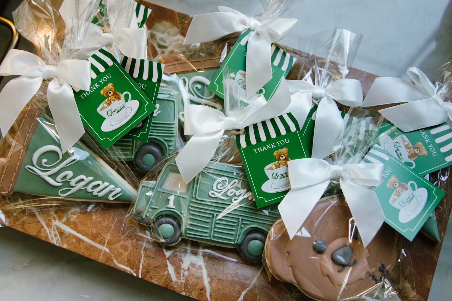 Wrapped gift packages with green and white striped decorative elements arranged in a display.