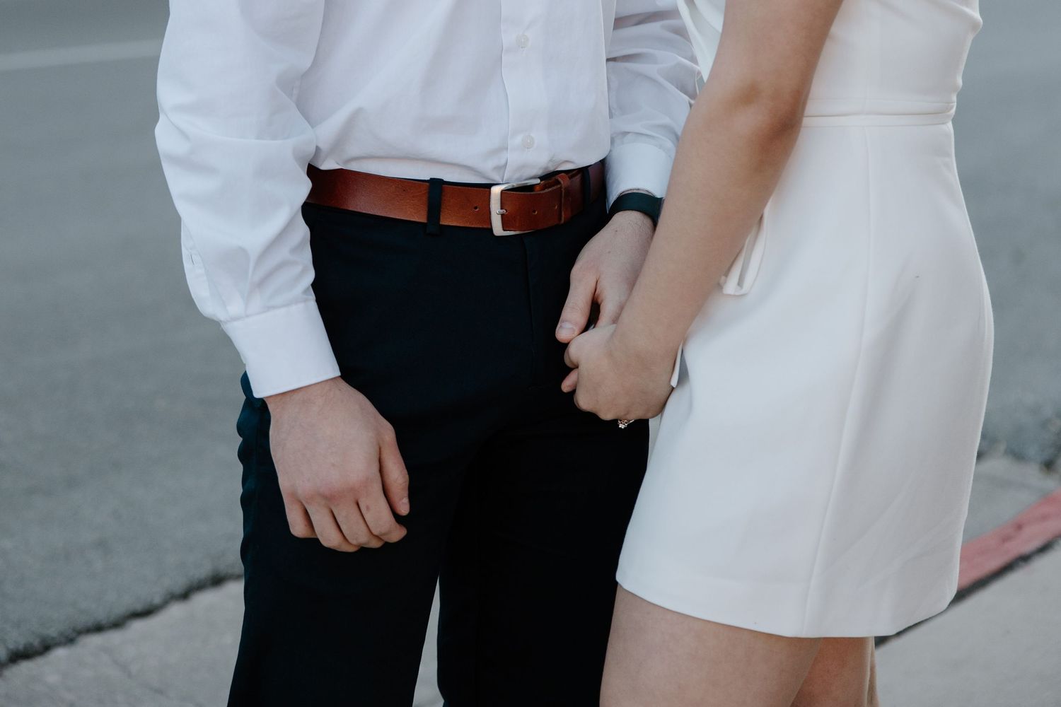 Close-up of formal attire showing white and black clothing details.