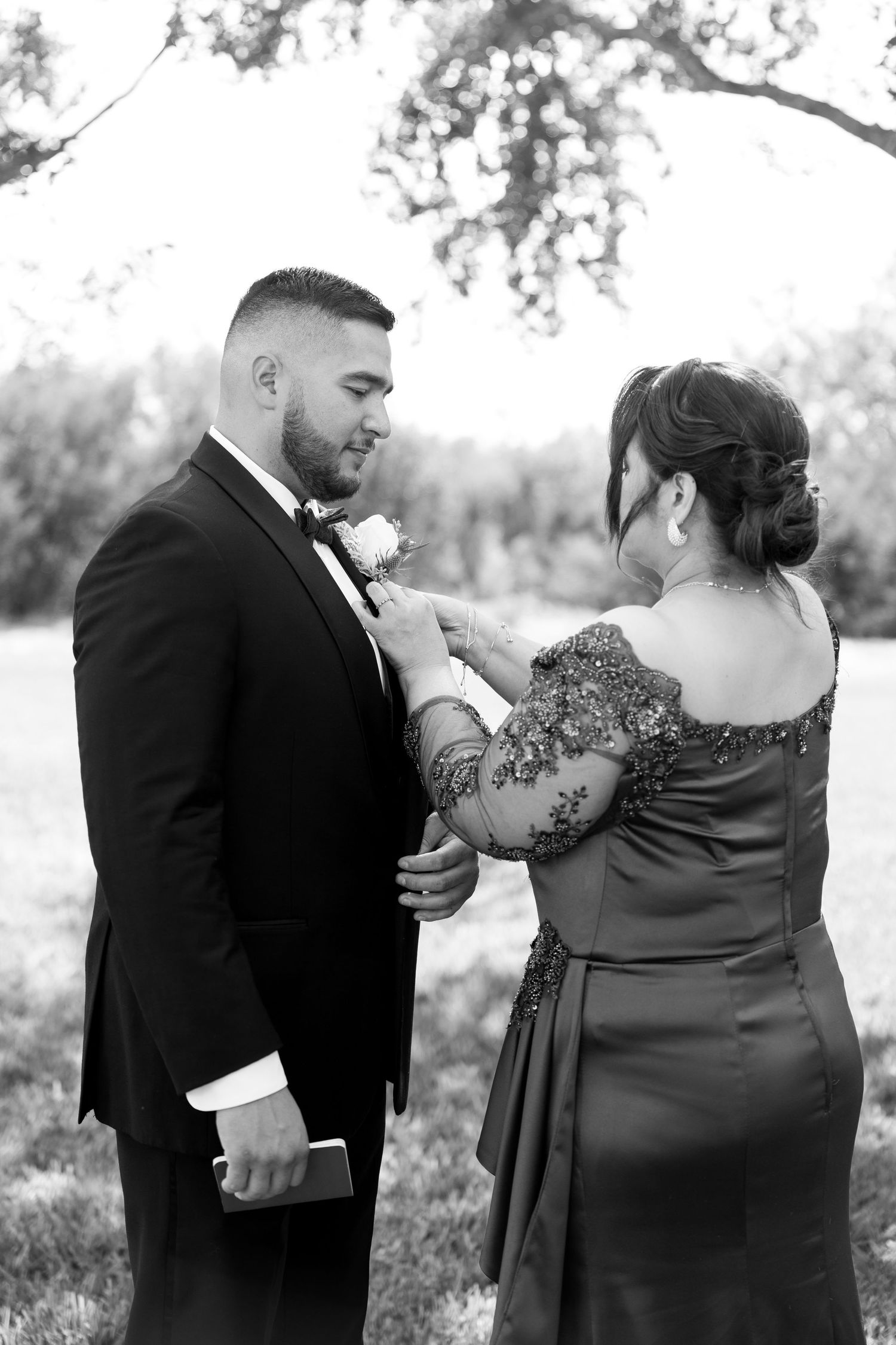 Black and white wedding portraits showing intimate moments between couple.