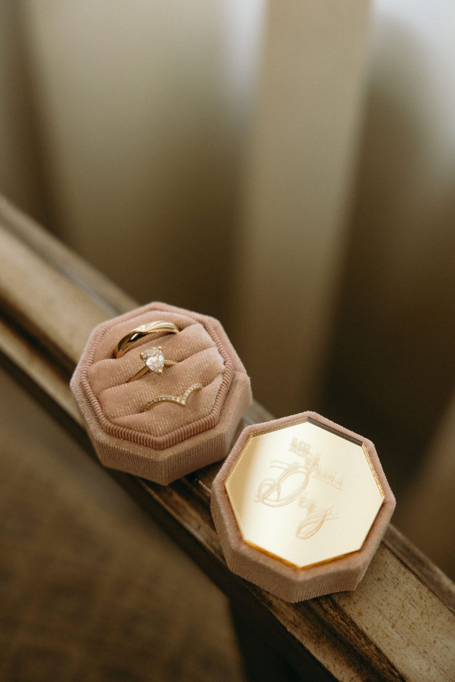 Hexagonal ring boxes displayed in sequence showing elegant engagement ring.