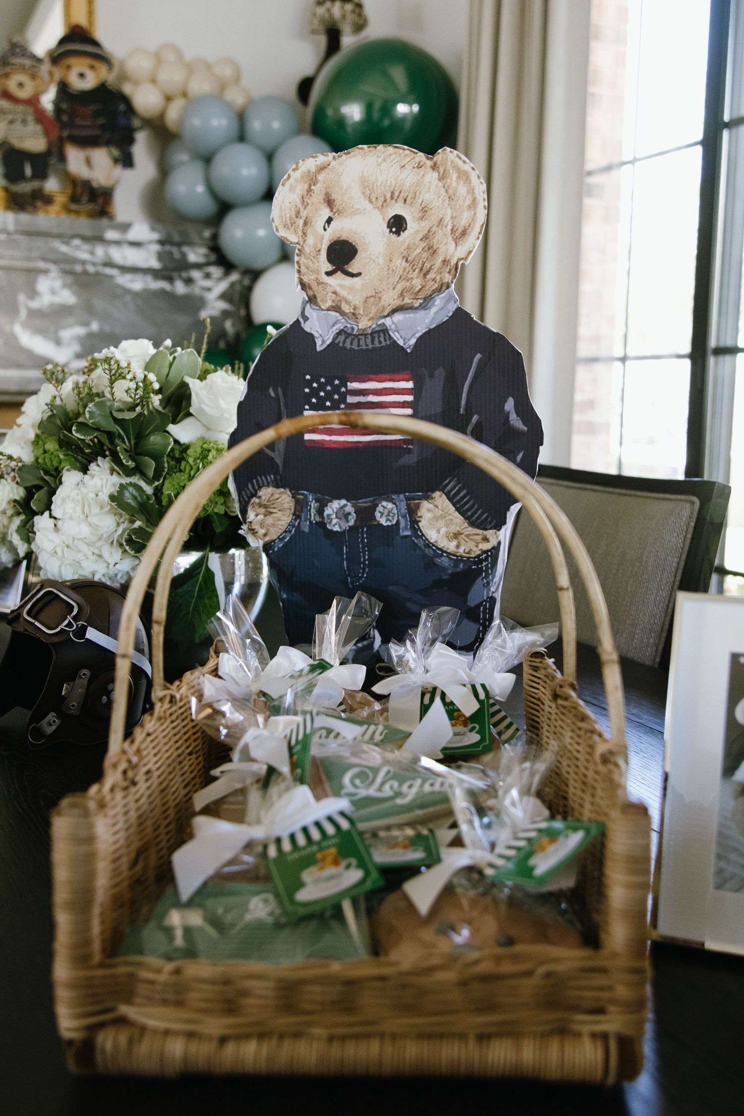 Teddy bears wearing patriotic clothing displayed in wicker baskets with green and white decorations.