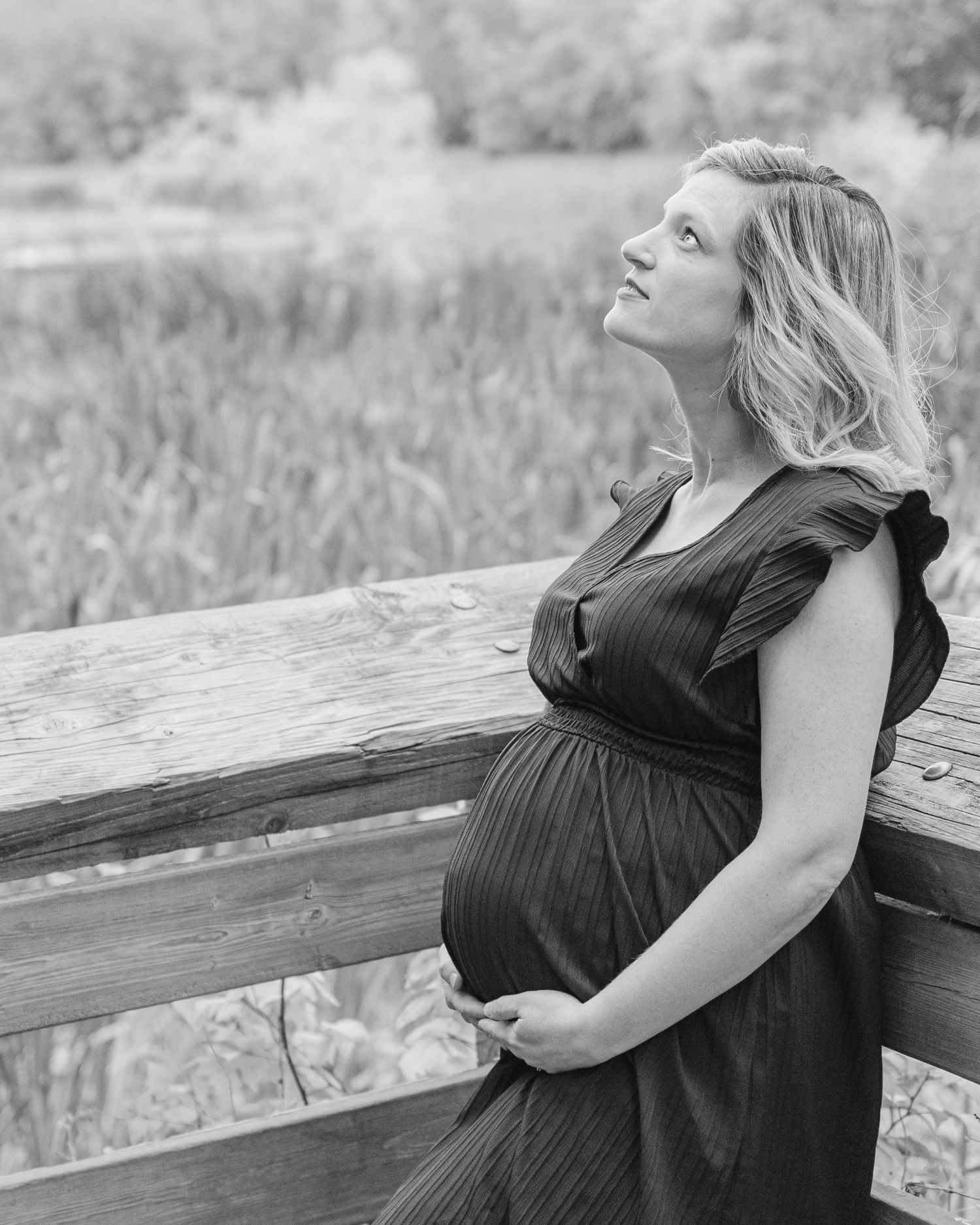 black and white maternity portrait of pregnant woman outdoors St Albert maternity photographer