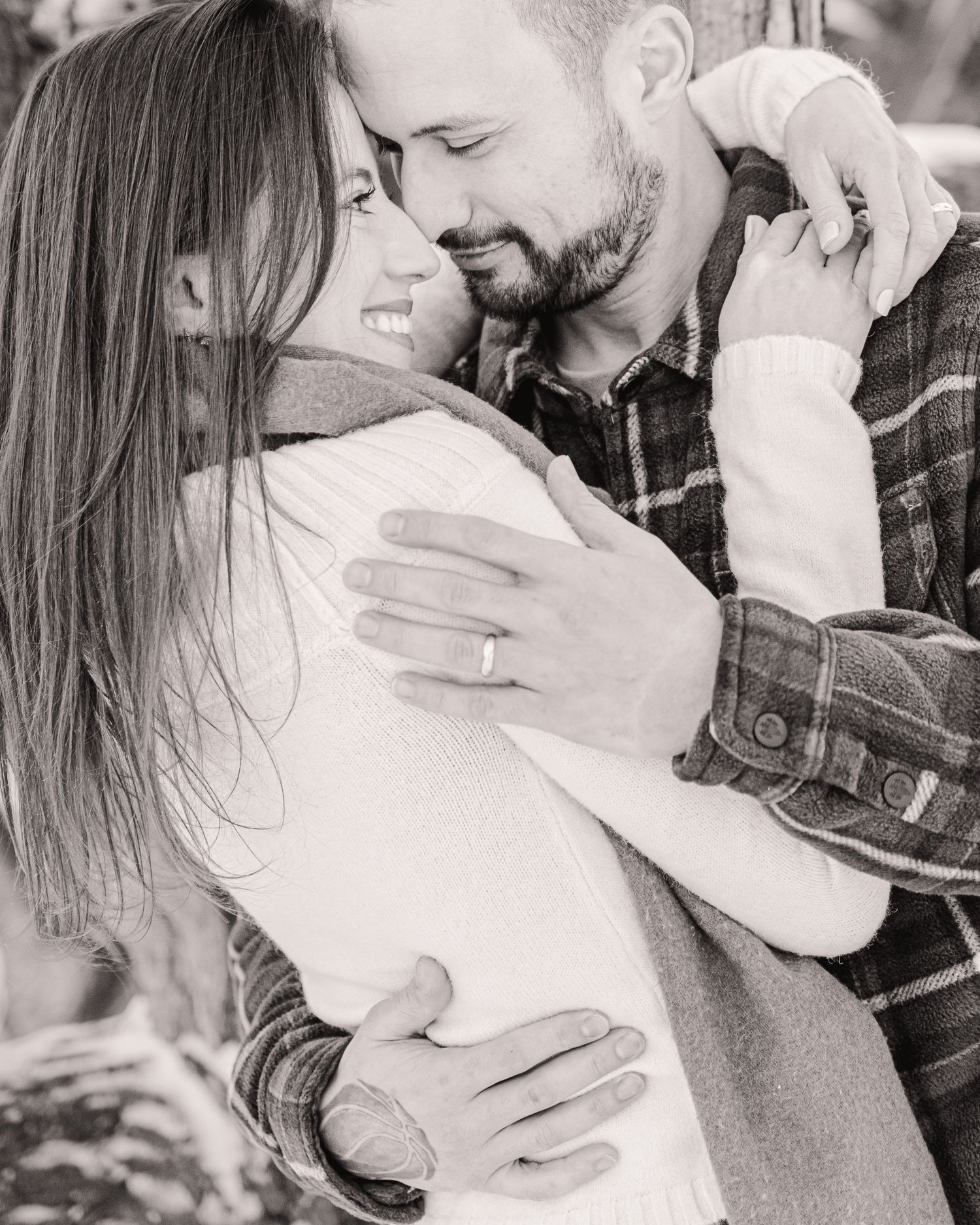 couple embracing outdoors winter engagement portrait St Albert photographer