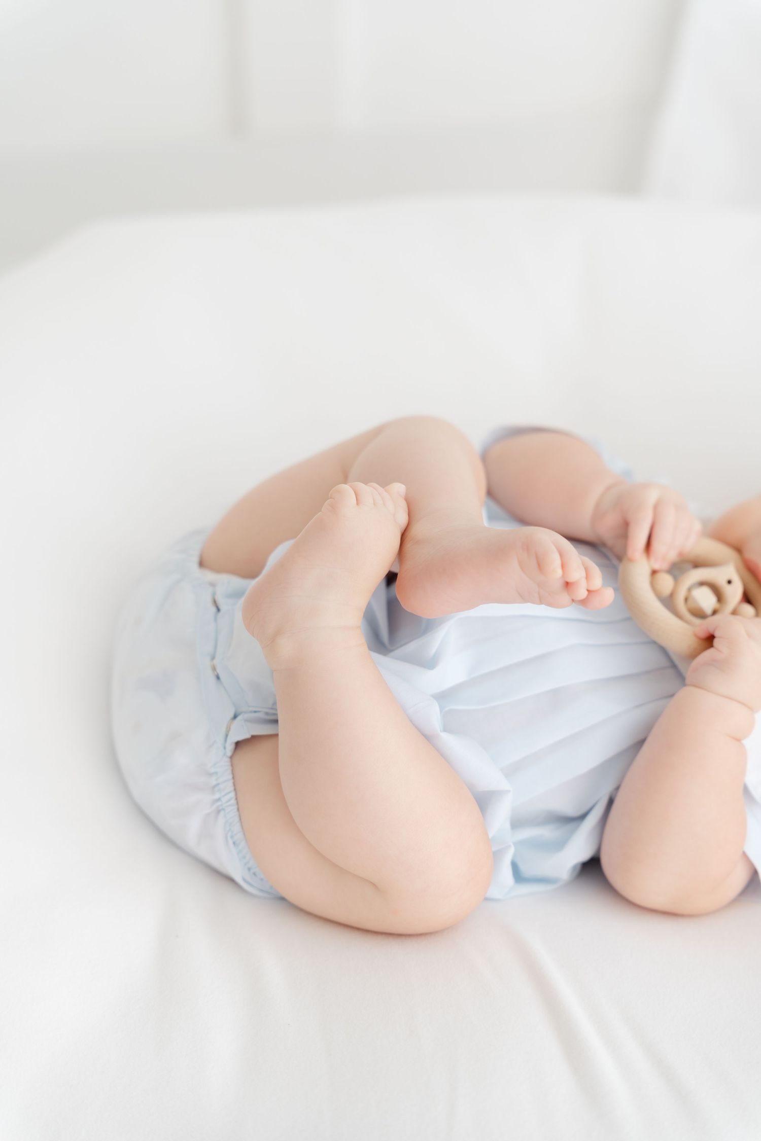 baby interacting naturally during studio milestone session