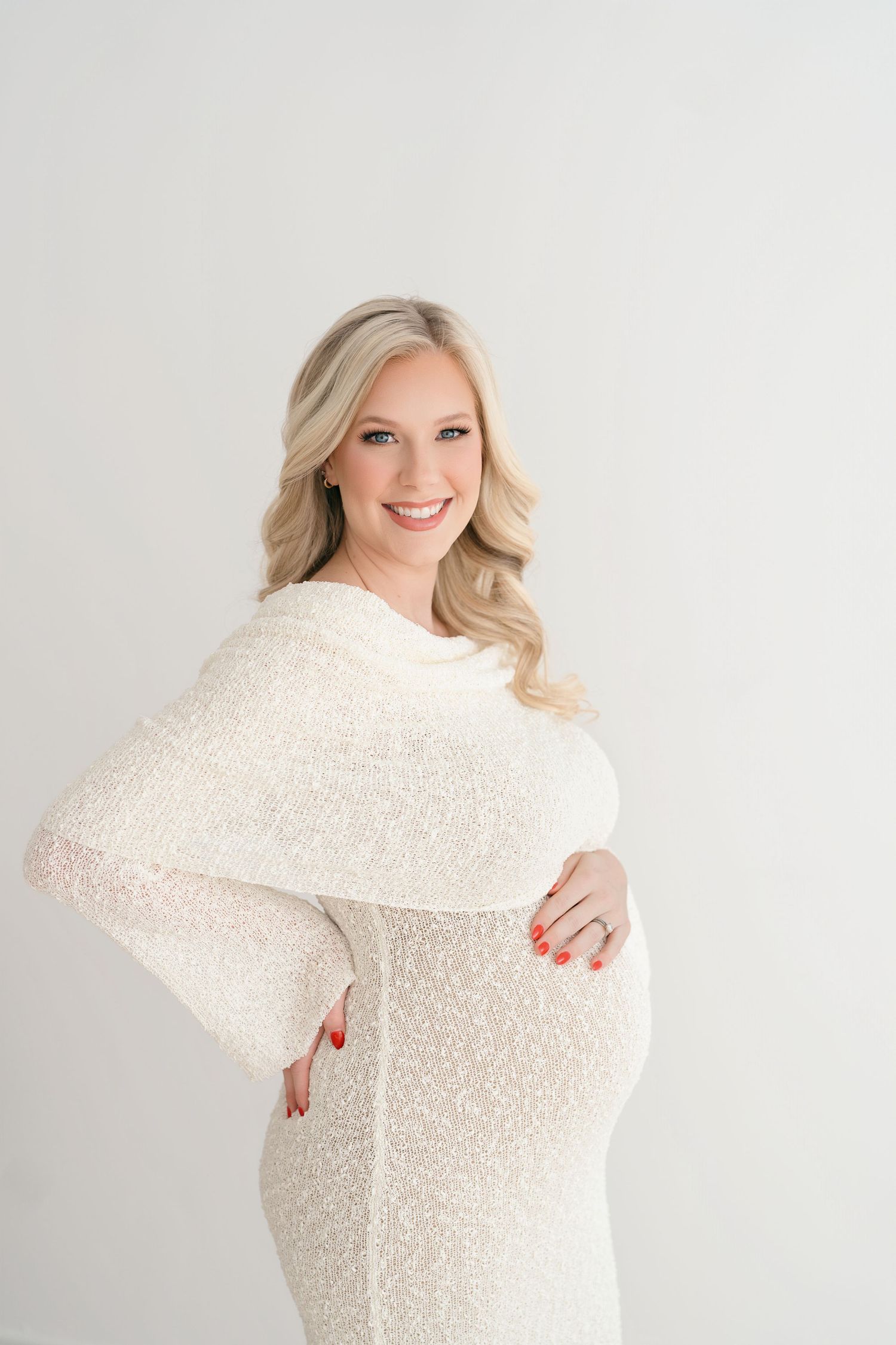A series of four photos showing a person wearing a cozy white knit sweater against a light gray background.