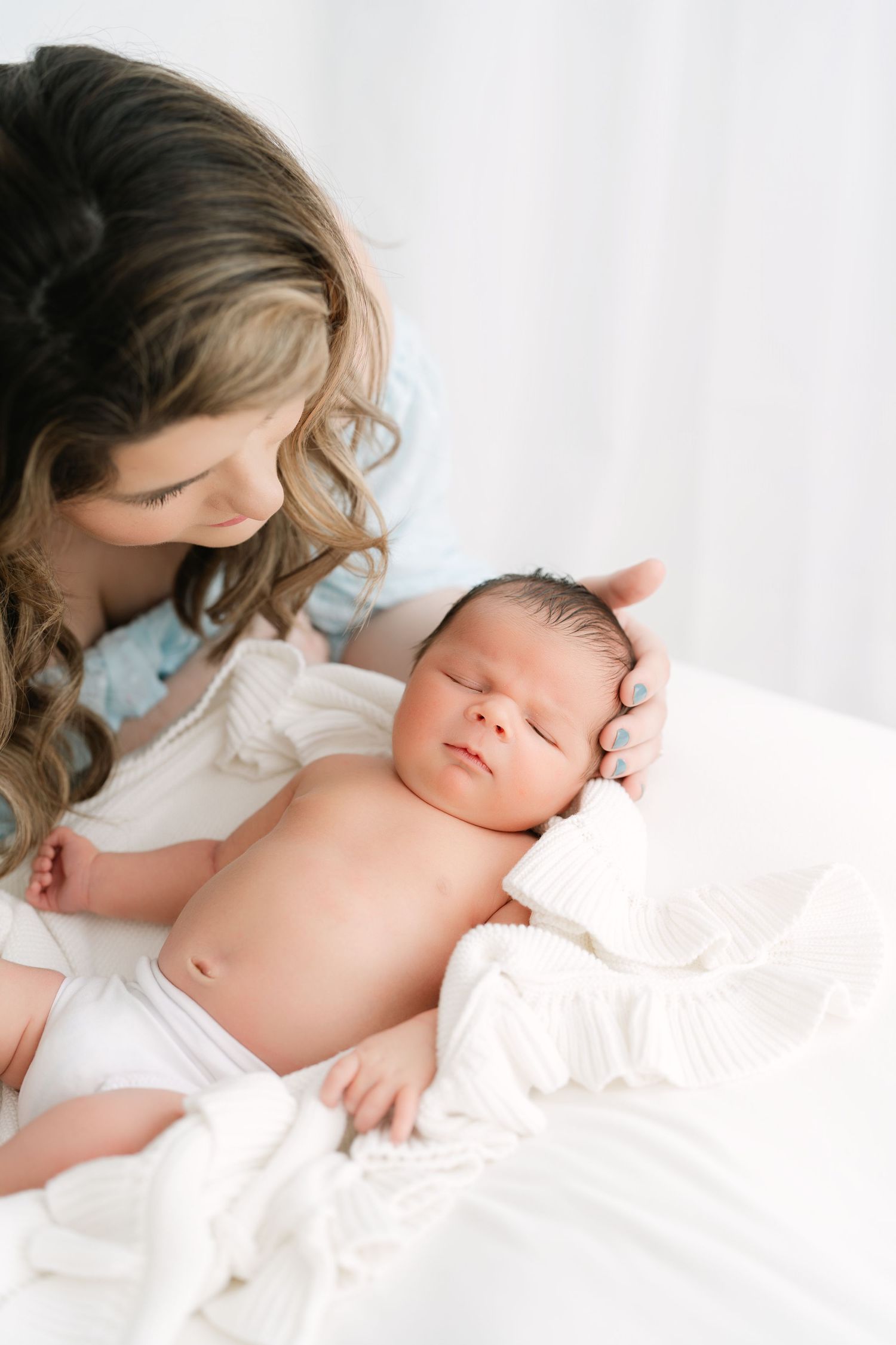 mother and newborn connection captured in Clarksville TN studio