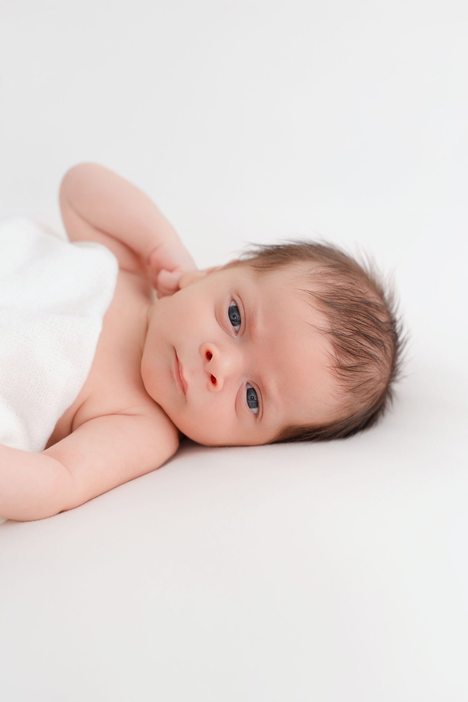 baby-led newborn session in Clarksville TN with soft white tones
