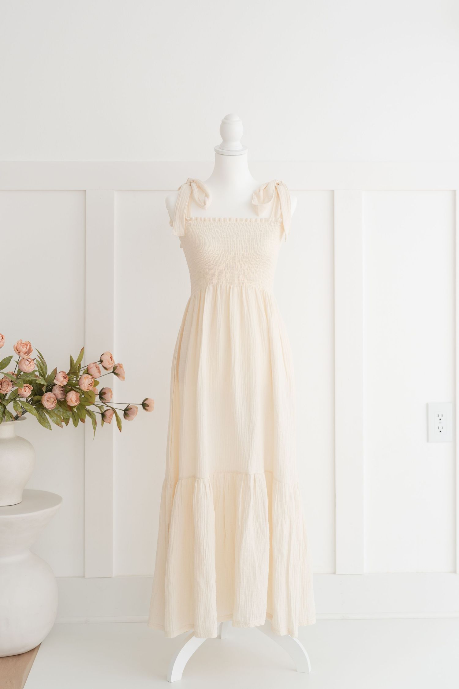 neutral-toned maternity dress from Clarksville TN photography studio wardrobe