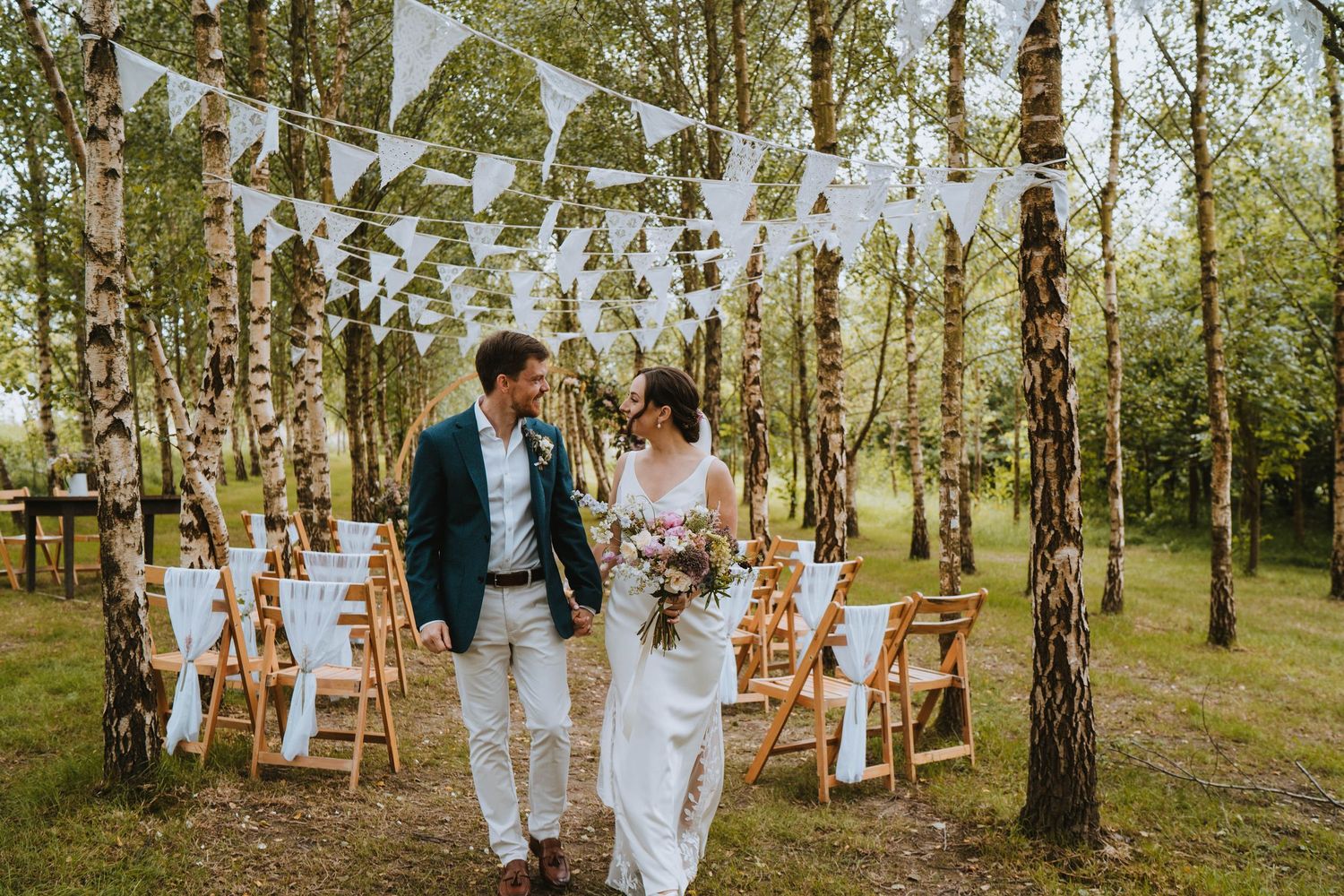 Bride and groom walking down aisle in forest ceremony, Devon wedding photographer; Capture You Photography