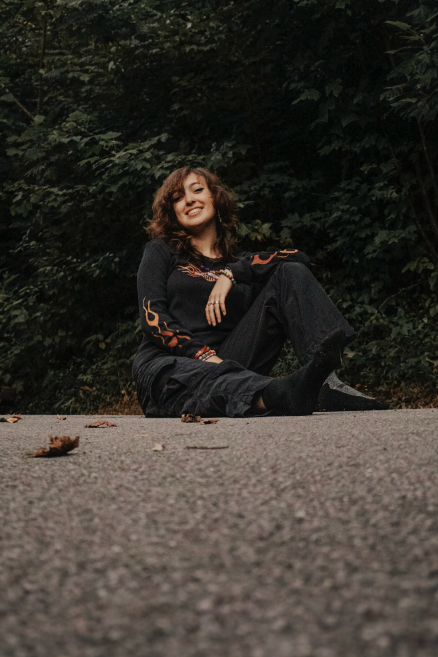 A series of frames showing a person in black clothing lying on gravel ground with dramatic body positions and movement.