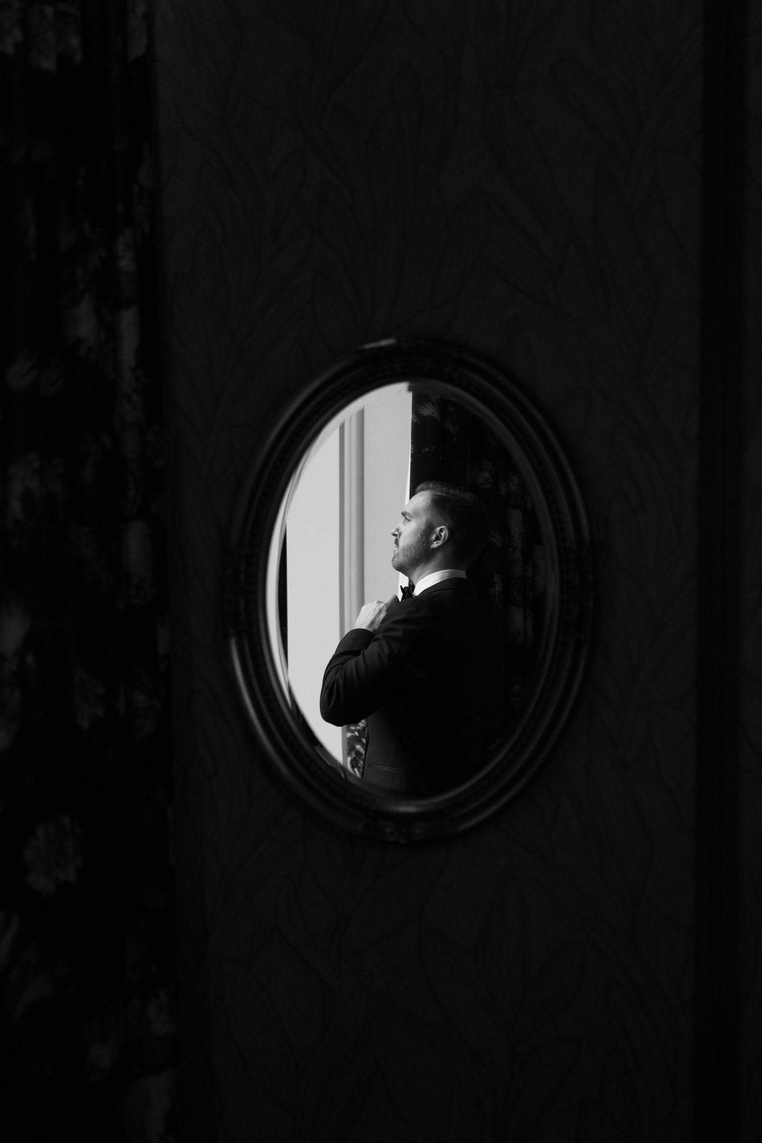 Groom getting ready, editorial pose, while getting ready in Chicago. The Alston Chicago