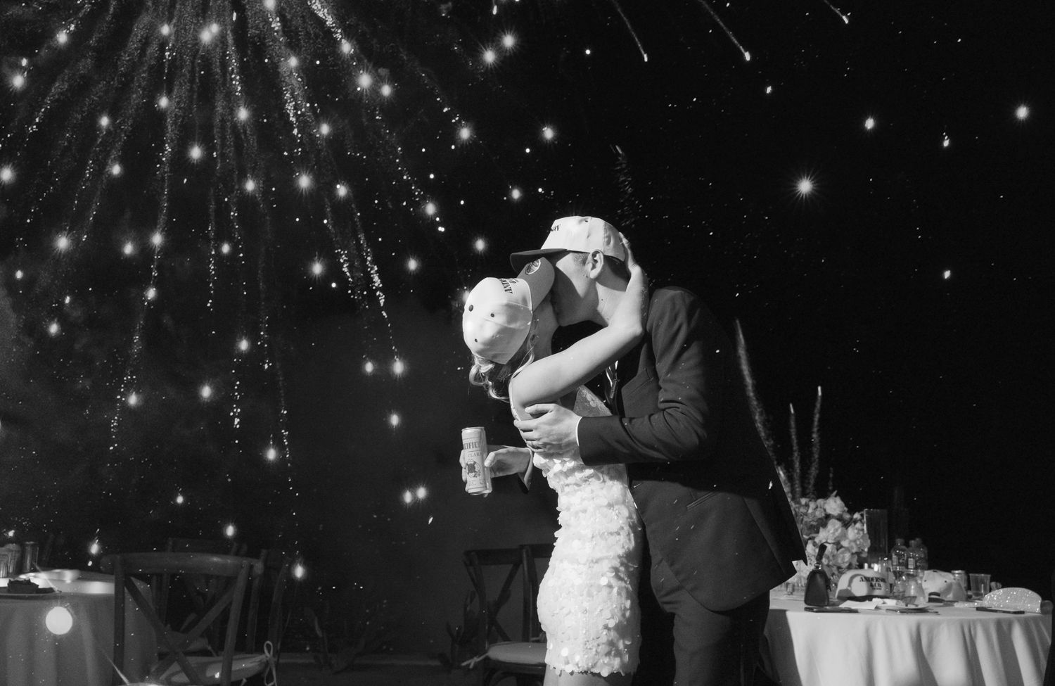 Romantic bride and groom on their wedding day ending the reception with fireworks in Cabo, Mexico. Sistered States wedding planner