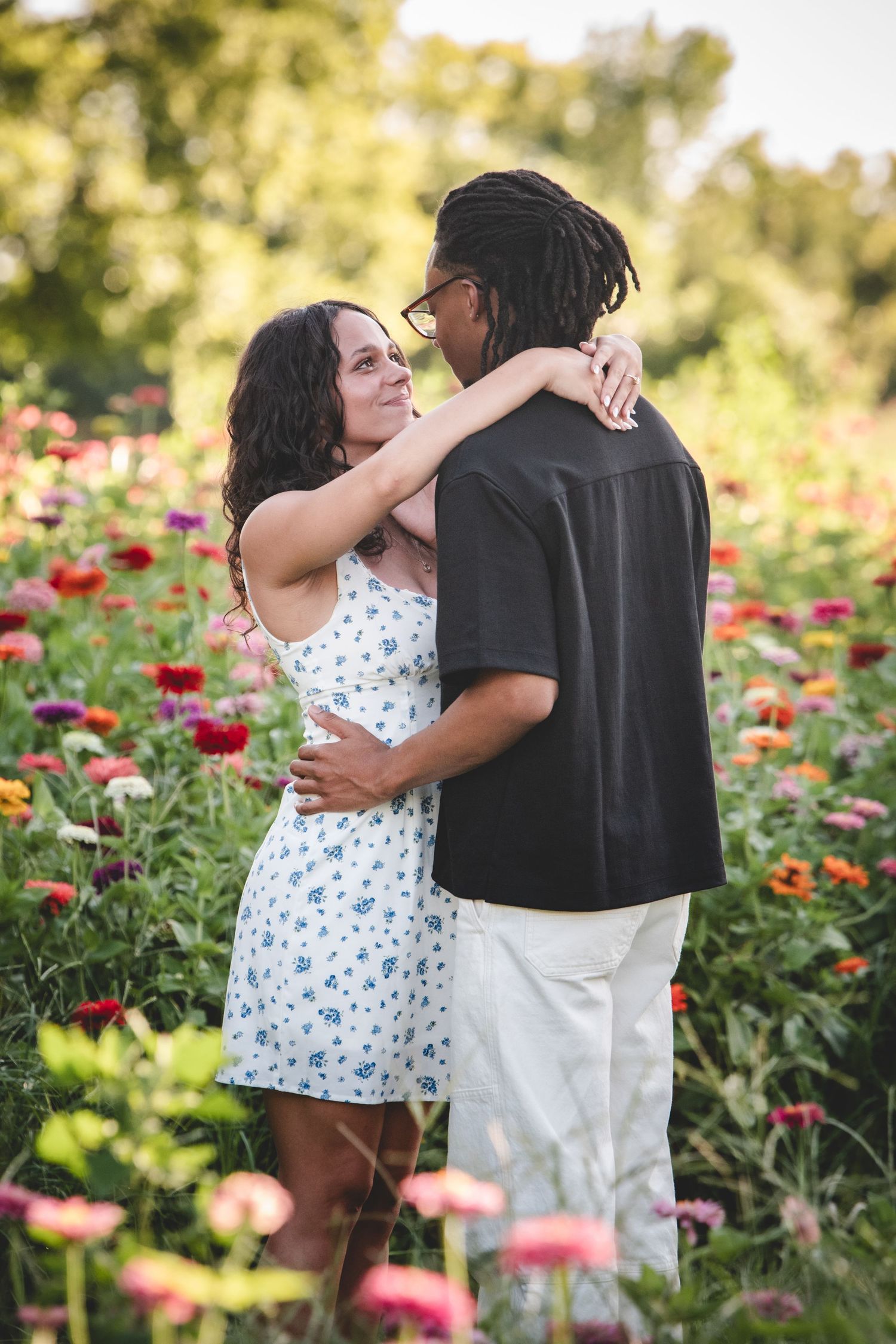 couple posing in a flower field