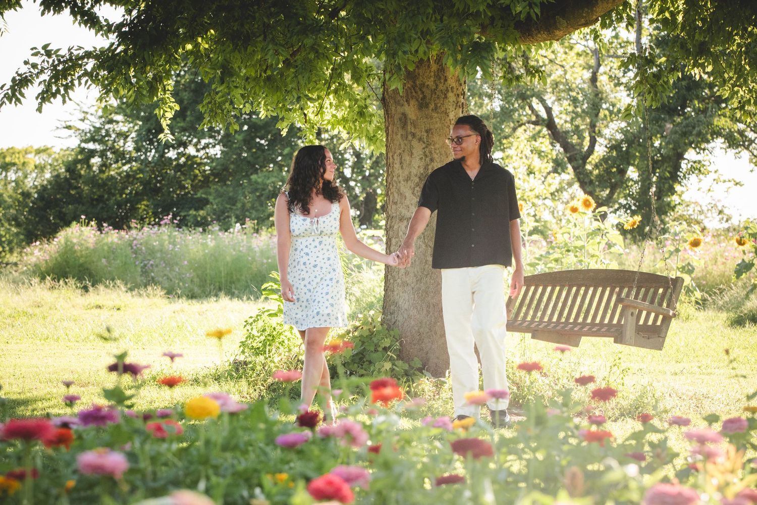 couple walking in a flower field