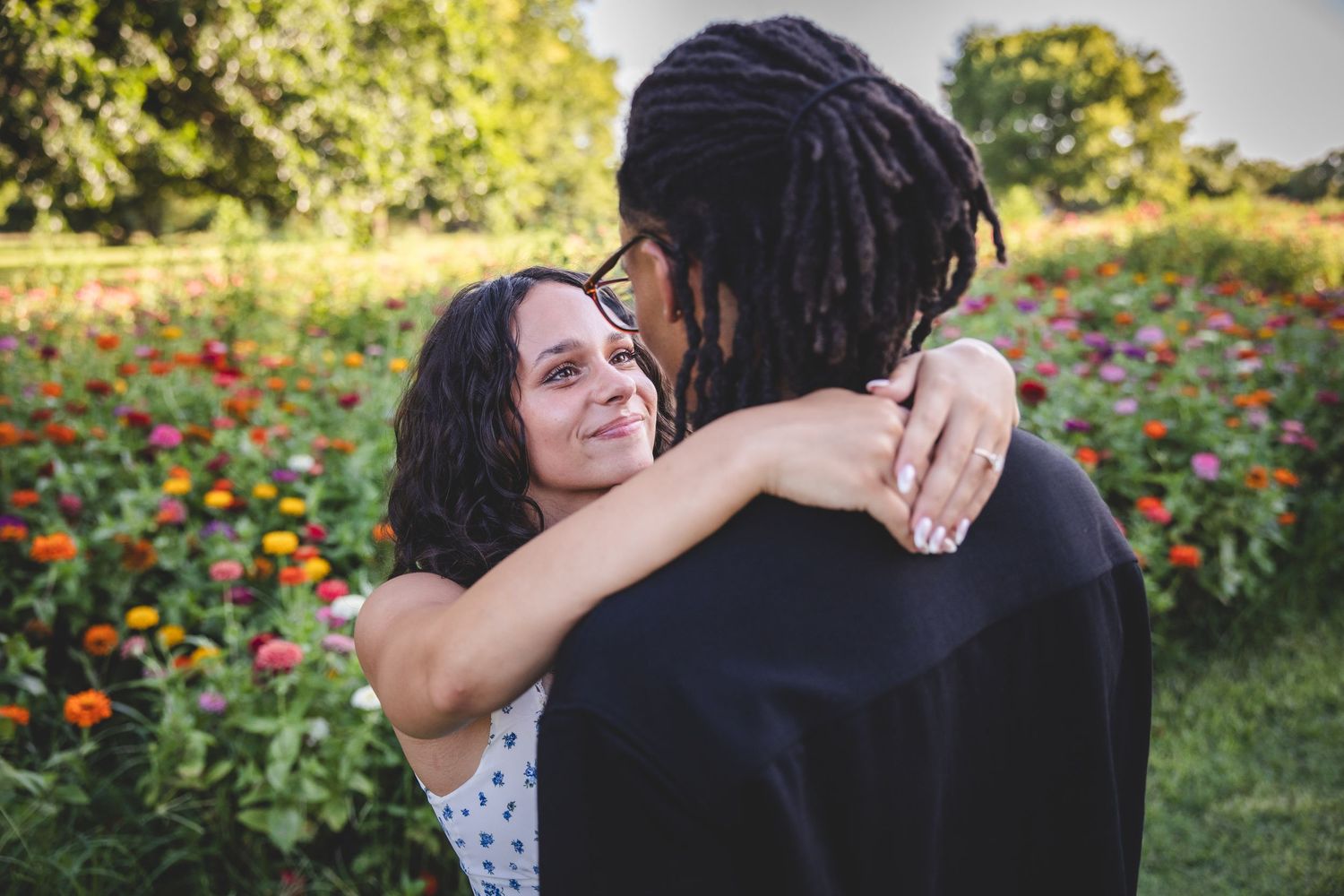 couple posing in a flower field