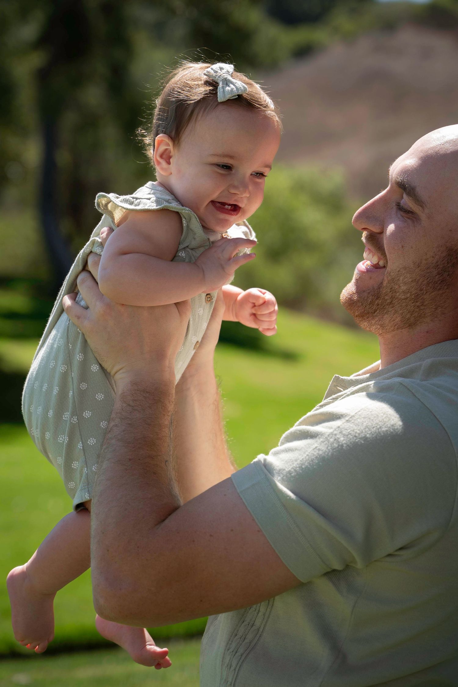 Candid moments of parent and child playing together outdoors in casual attire.
