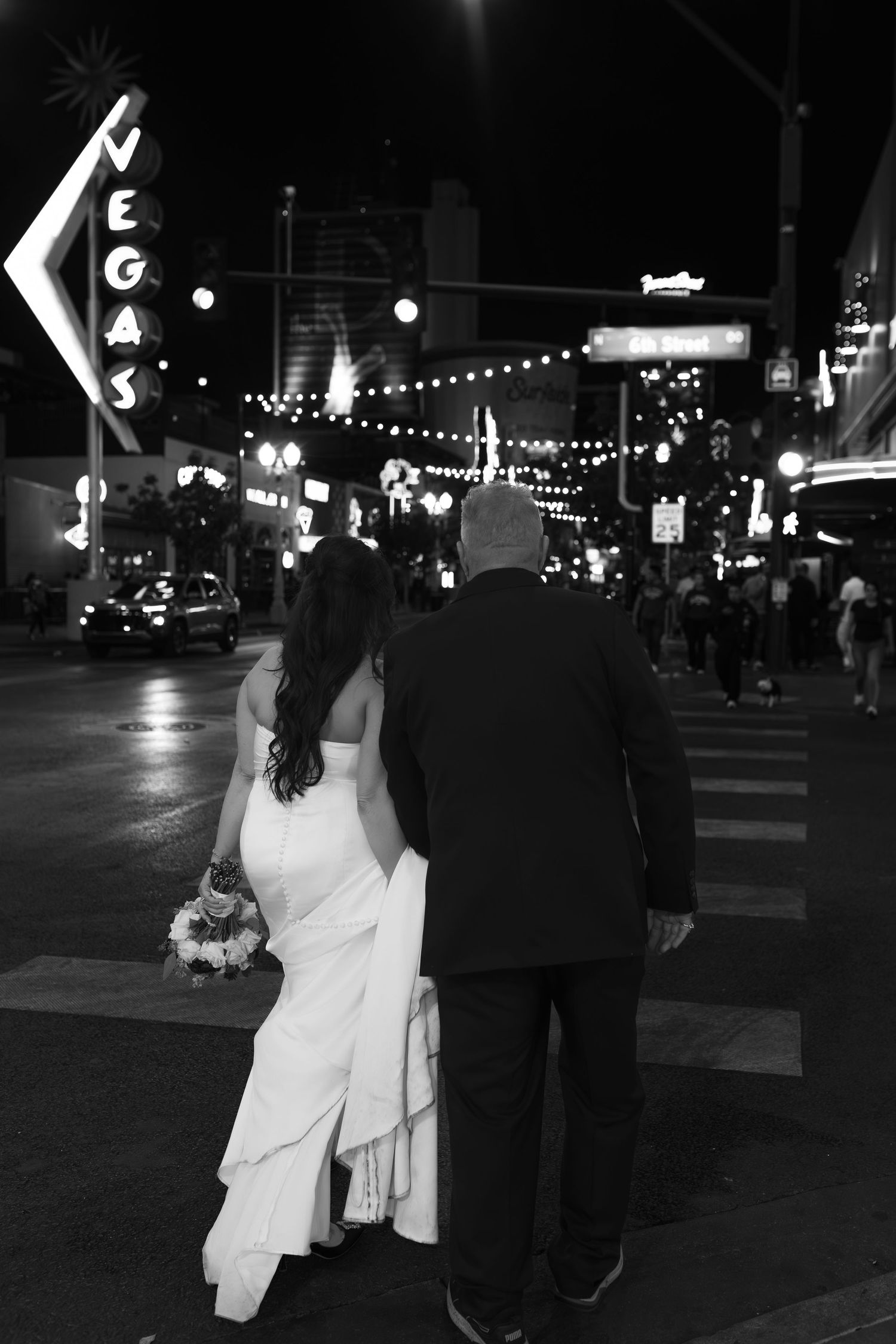 Couples eloping under neon lights on Fremont Street-Las Vegas photographer