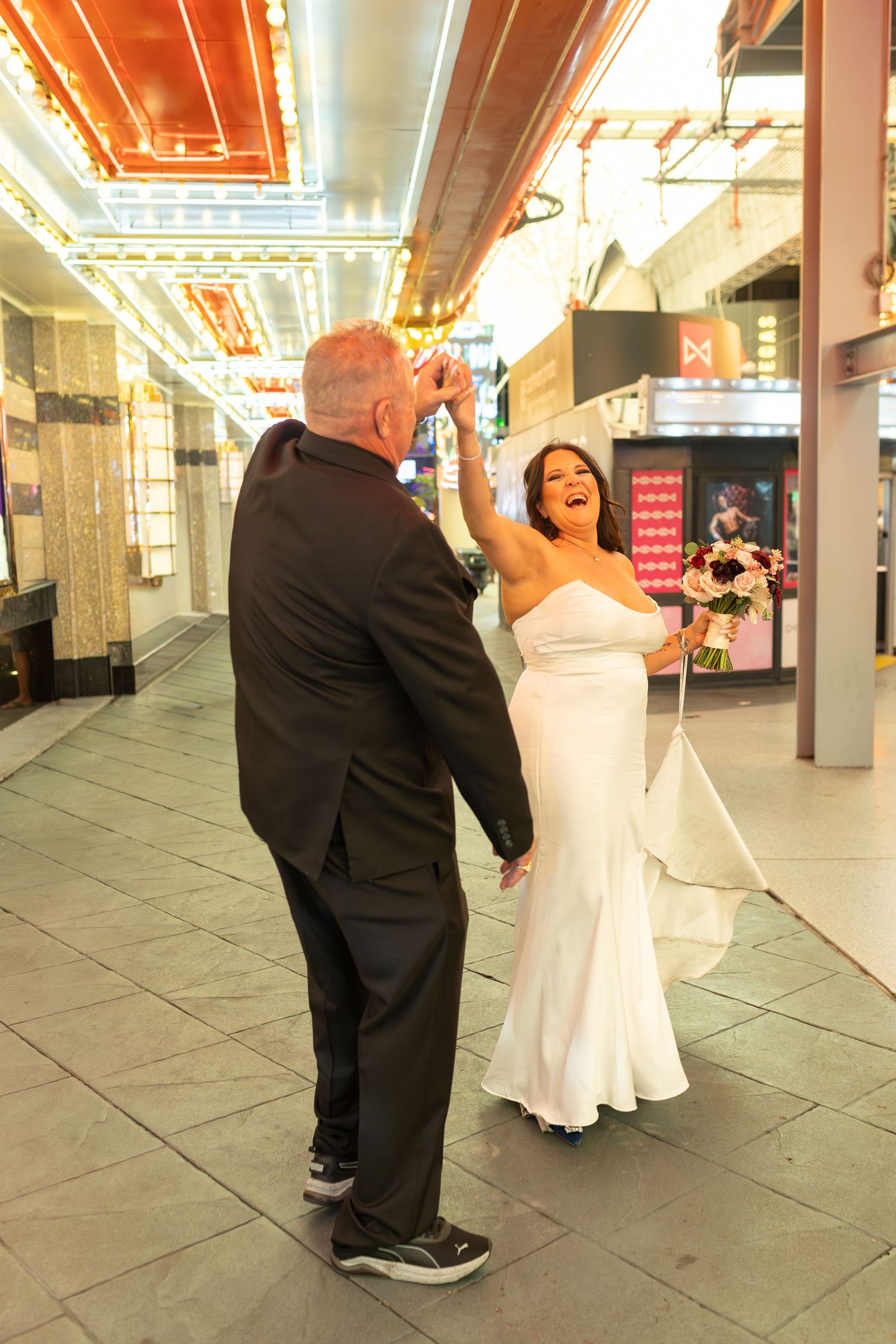 Couples eloping under neon lights on Fremont Street-Las Vegas photographer