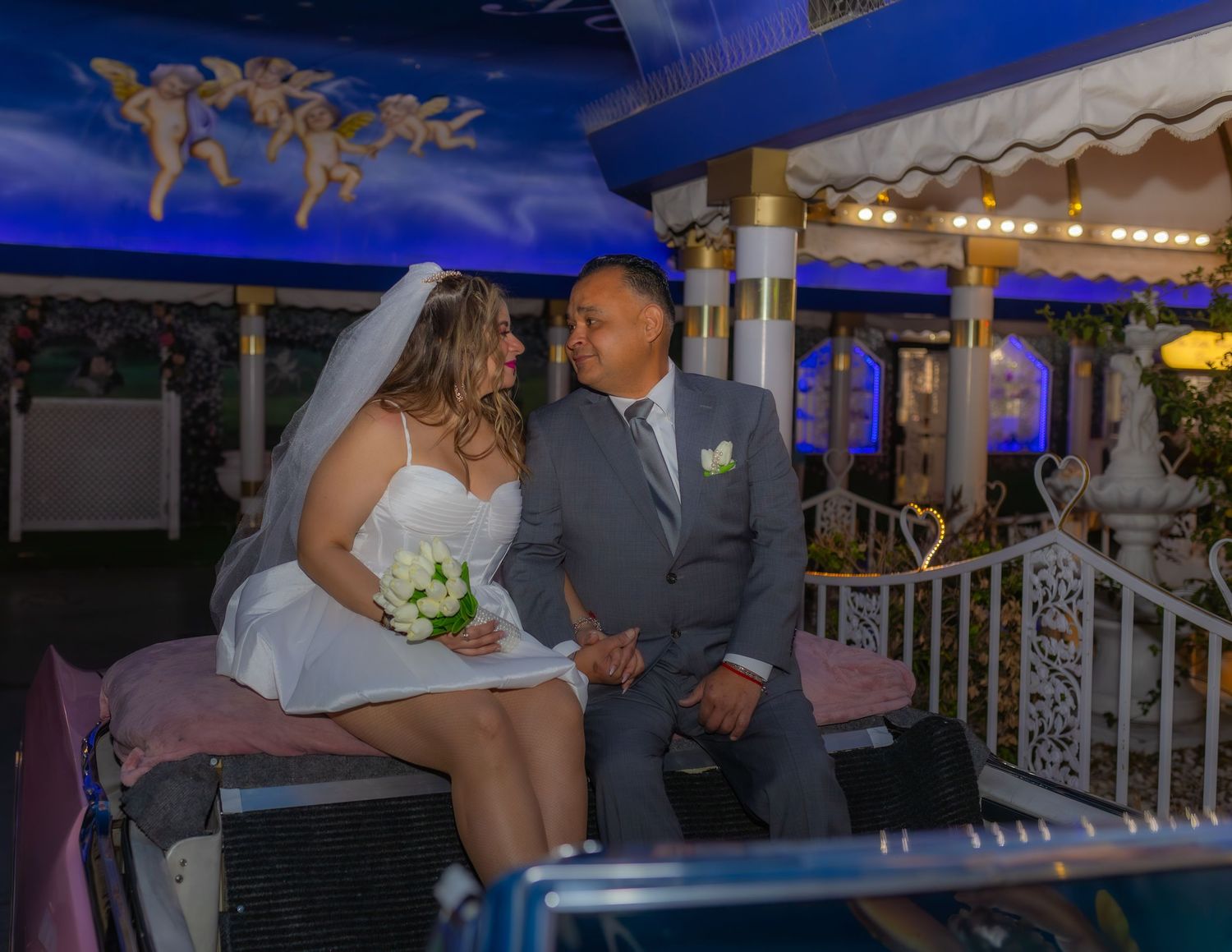 Bride and groom eloping at the Little White chapel in Las Vegas-pink Cadillac-Las Vegas elopement photographer