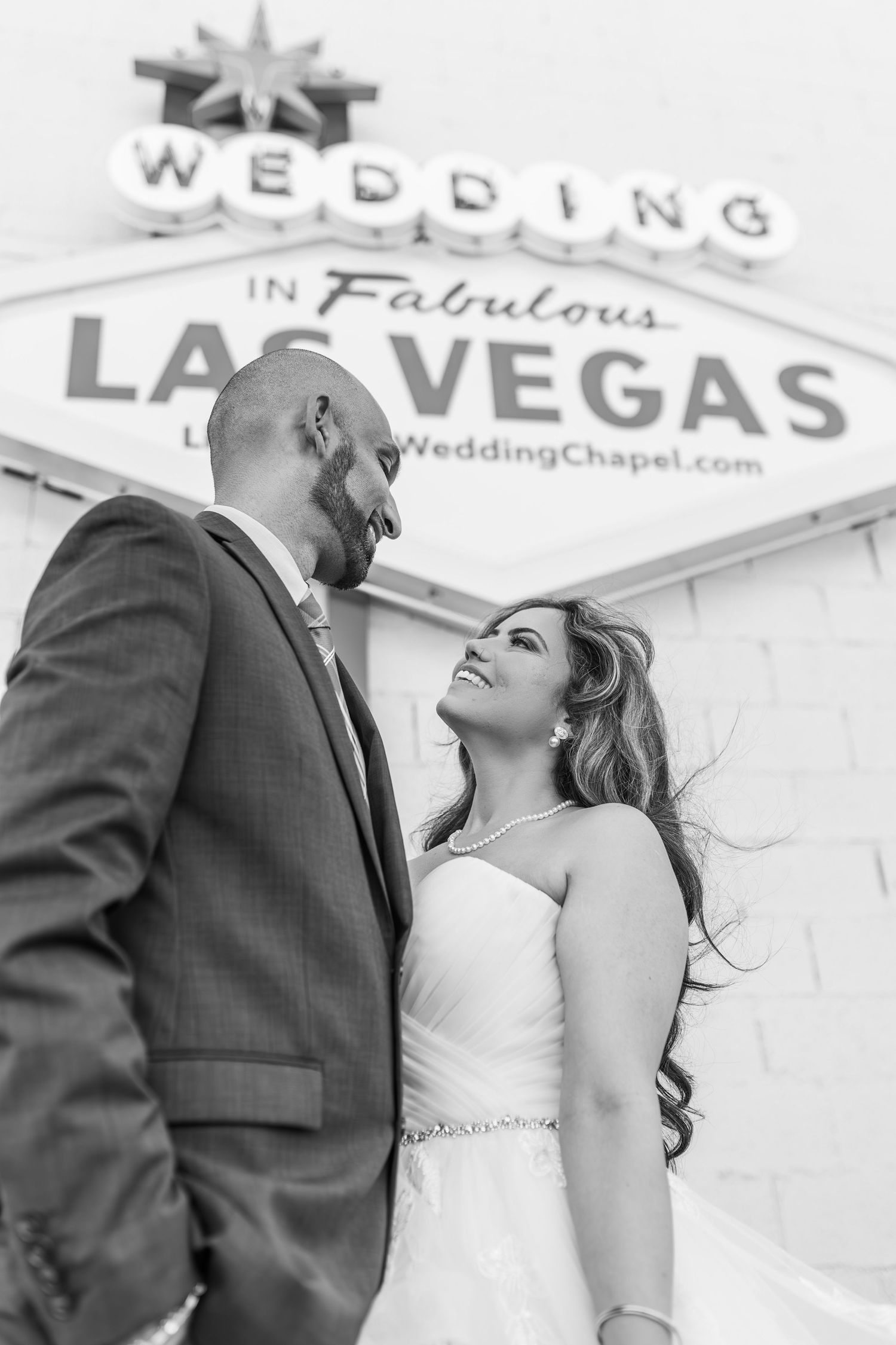 Bride and groom exchanging vows at the Little White chapel in downtown Las Vegas- intimate wedding and elopement photographer