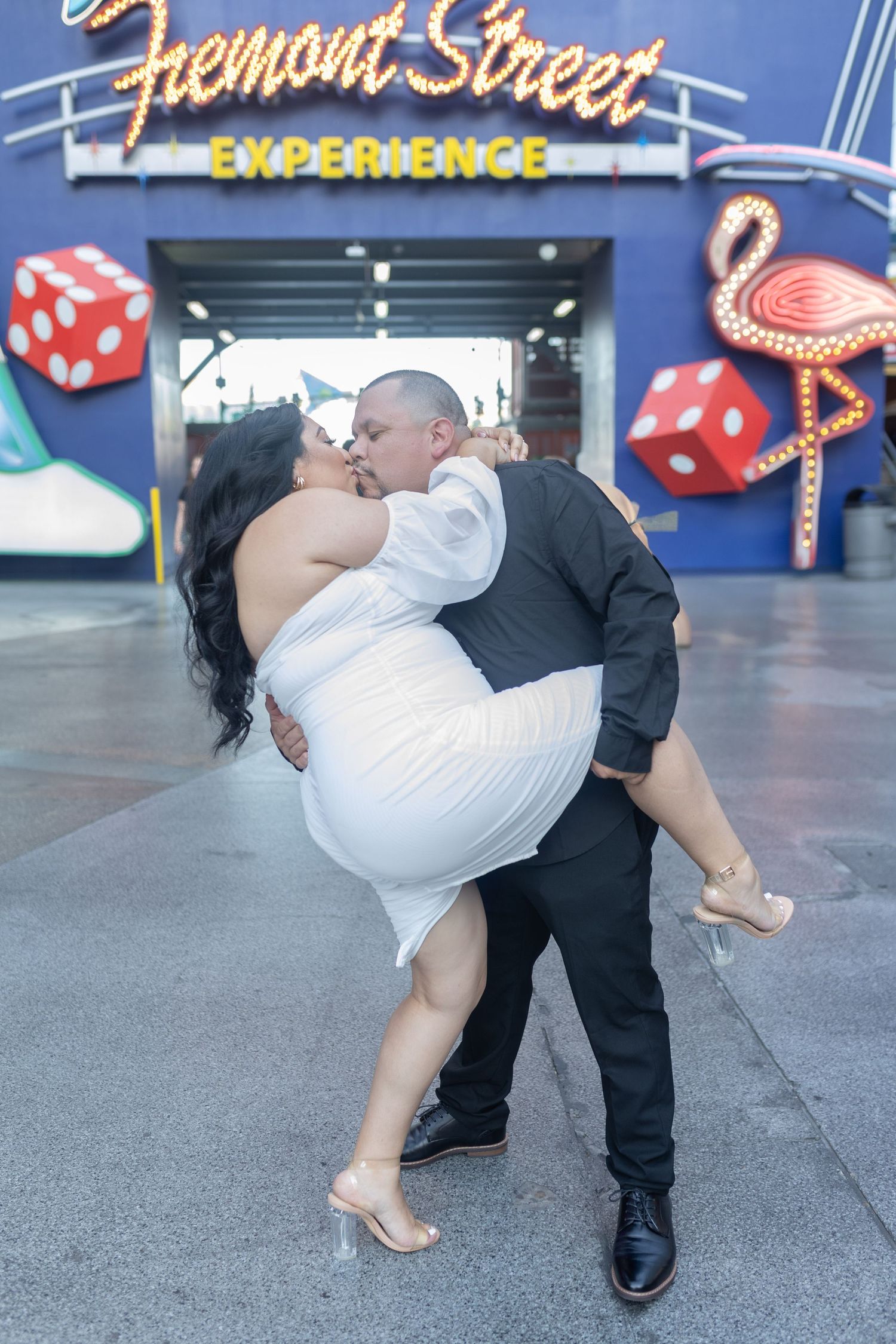 Couples eloping under neon lights on Fremont Street-Las Vegas photographer