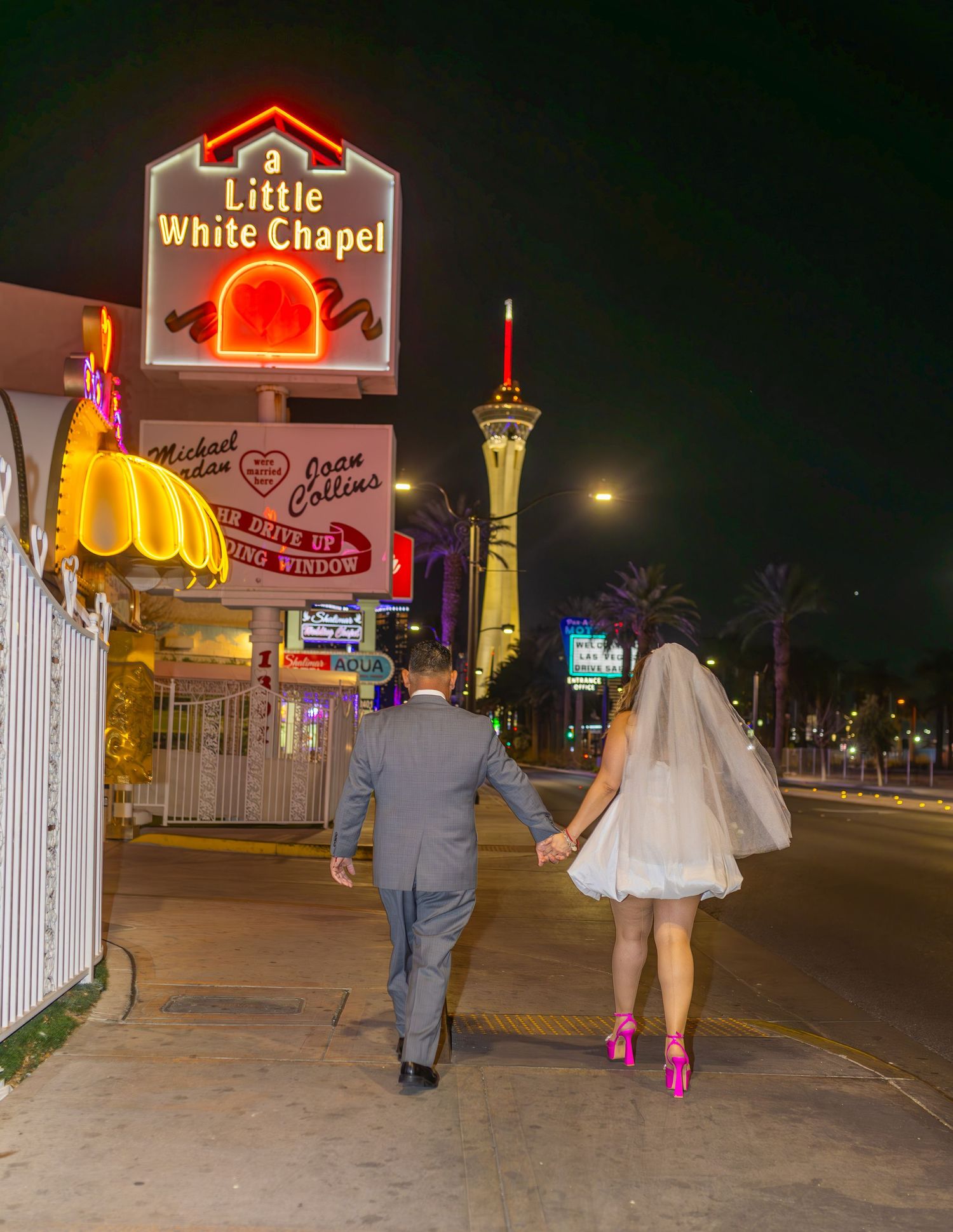 Bride and groom exchanging vows at the Little White chapel in downtown Las Vegas- intimate wedding and elopement photographer