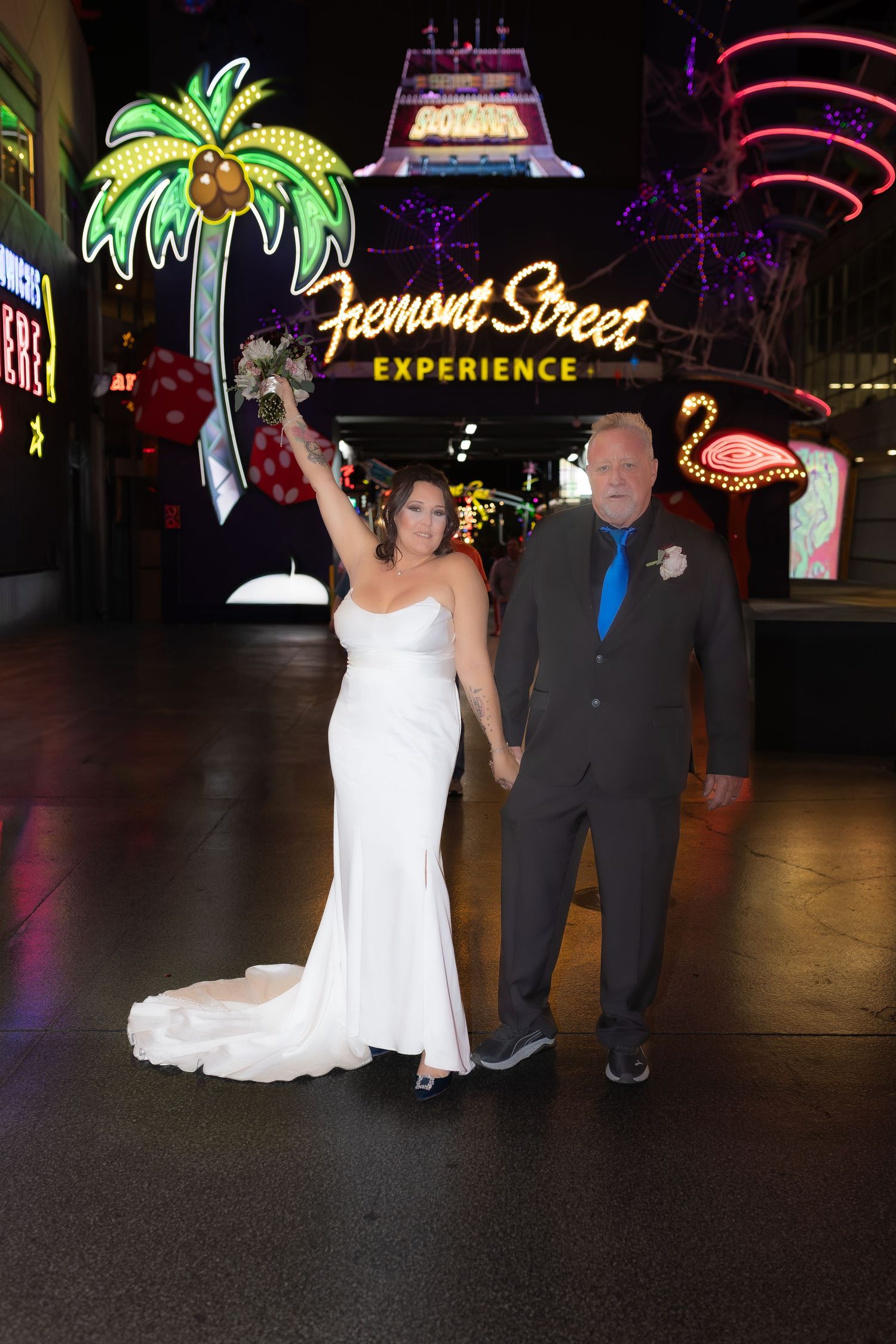 Couples eloping under neon lights on Fremont Street-Las Vegas photographer