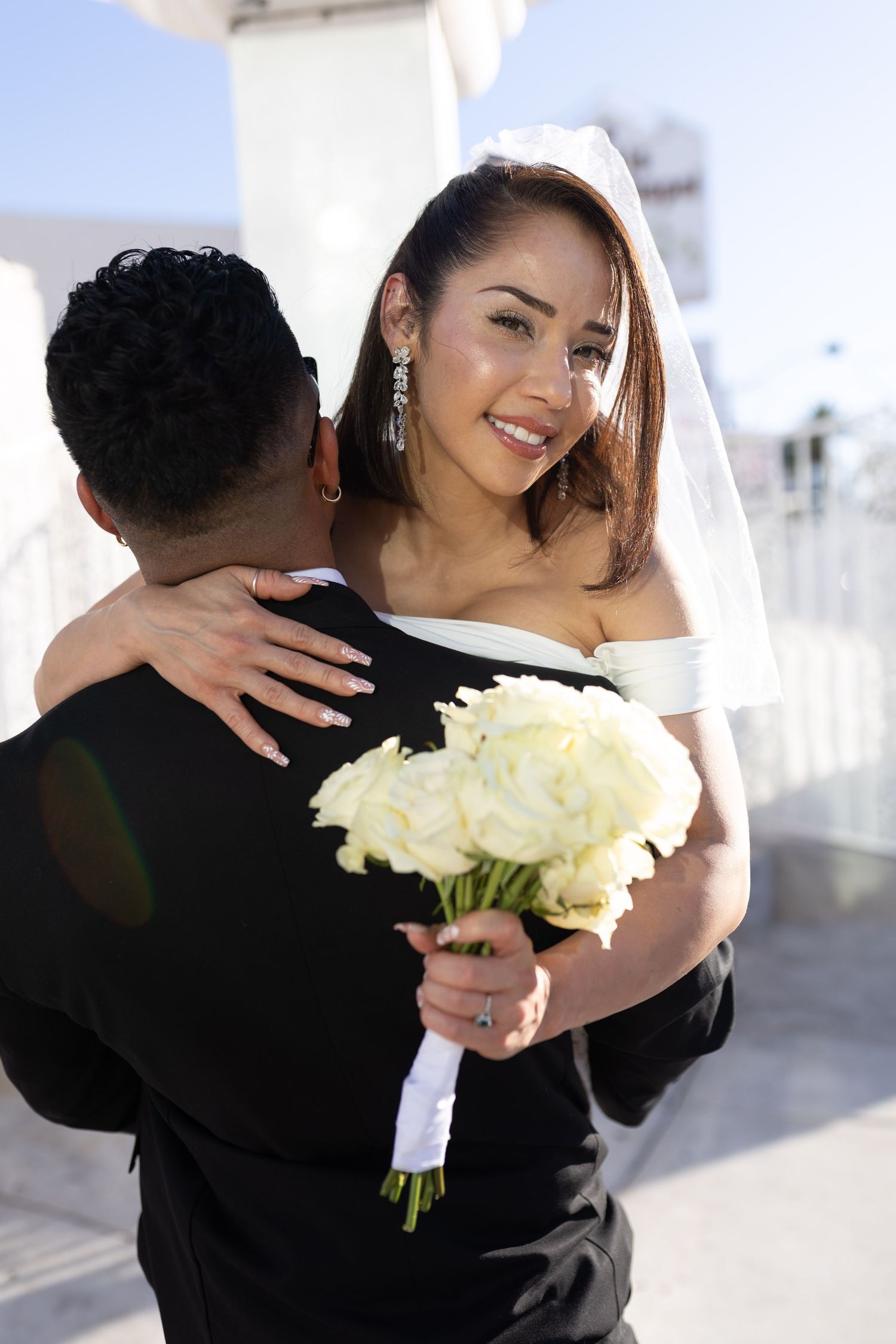 Bride and groom exchanging vows at the Little White chapel in downtown Las Vegas- intimate wedding and elopement photographer