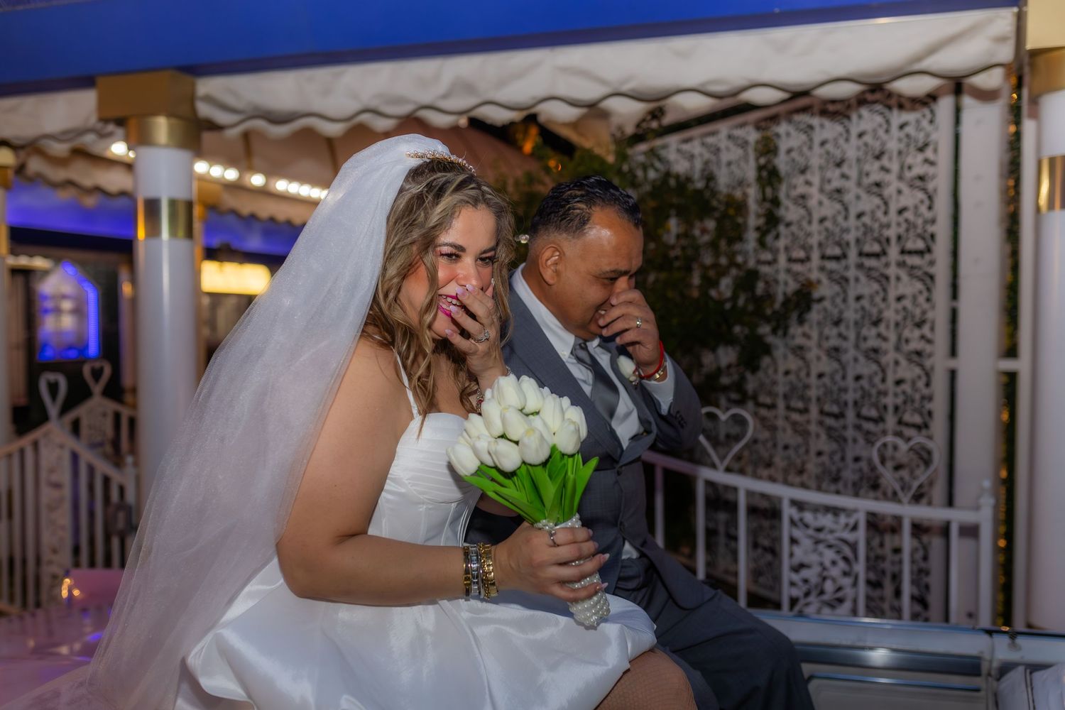Bride and groom eloping at the Little White chapel in Las Vegas-pink Cadillac-Las Vegas elopement photographer