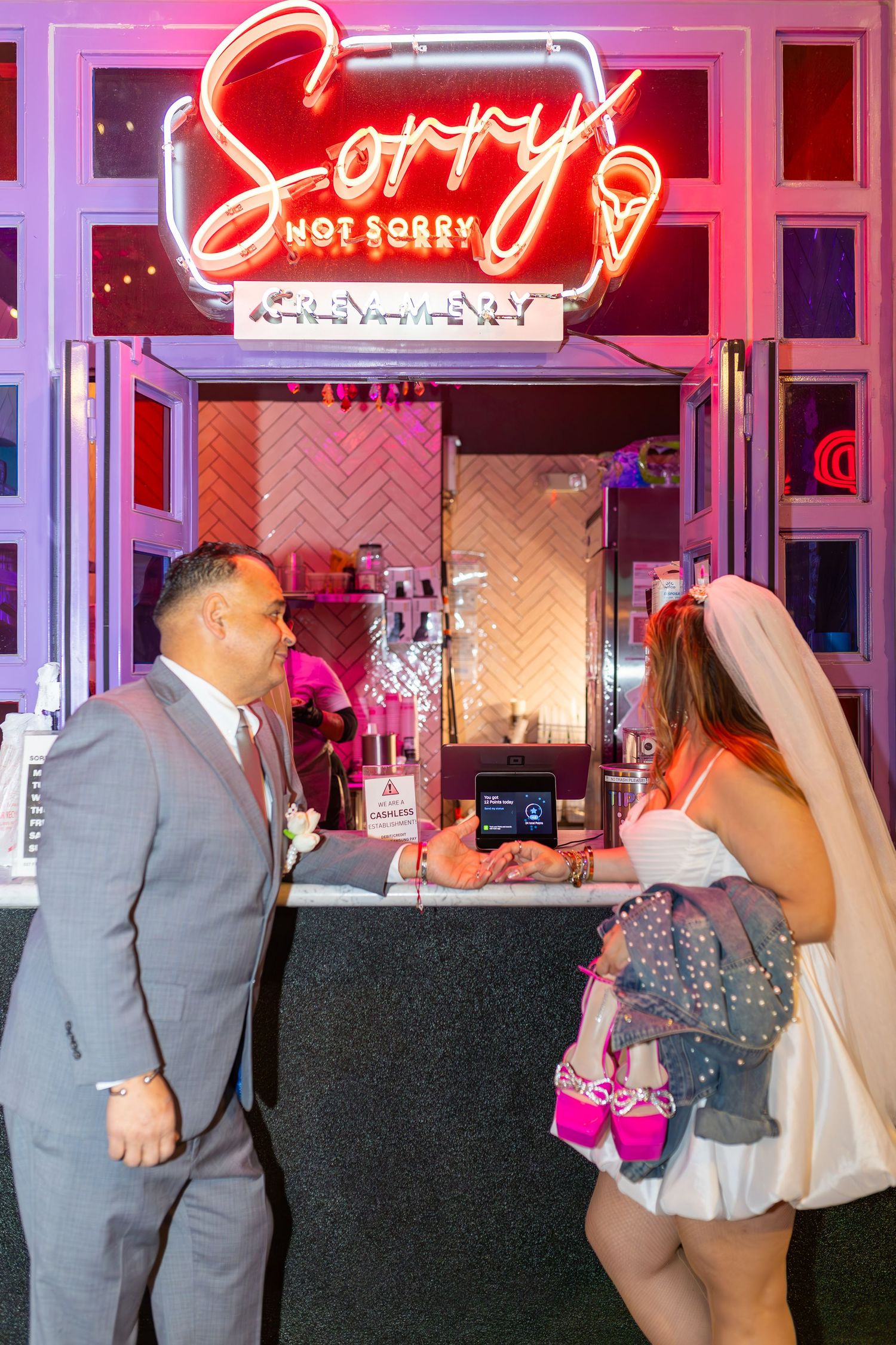 Couples eloping under neon lights on Fremont Street-Las Vegas photographer