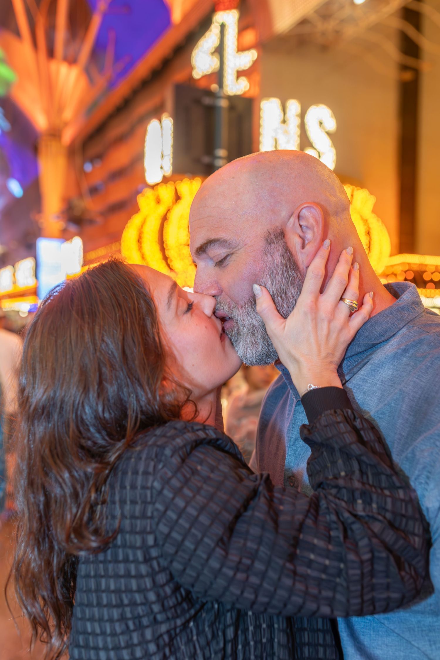 Couples eloping under neon lights on Fremont Street-Las Vegas photographer